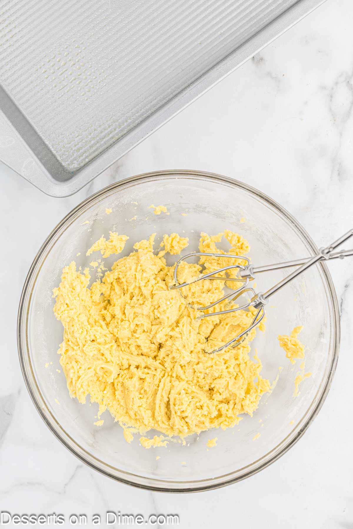 Cake mix ingredients combined in a mixing bowl.