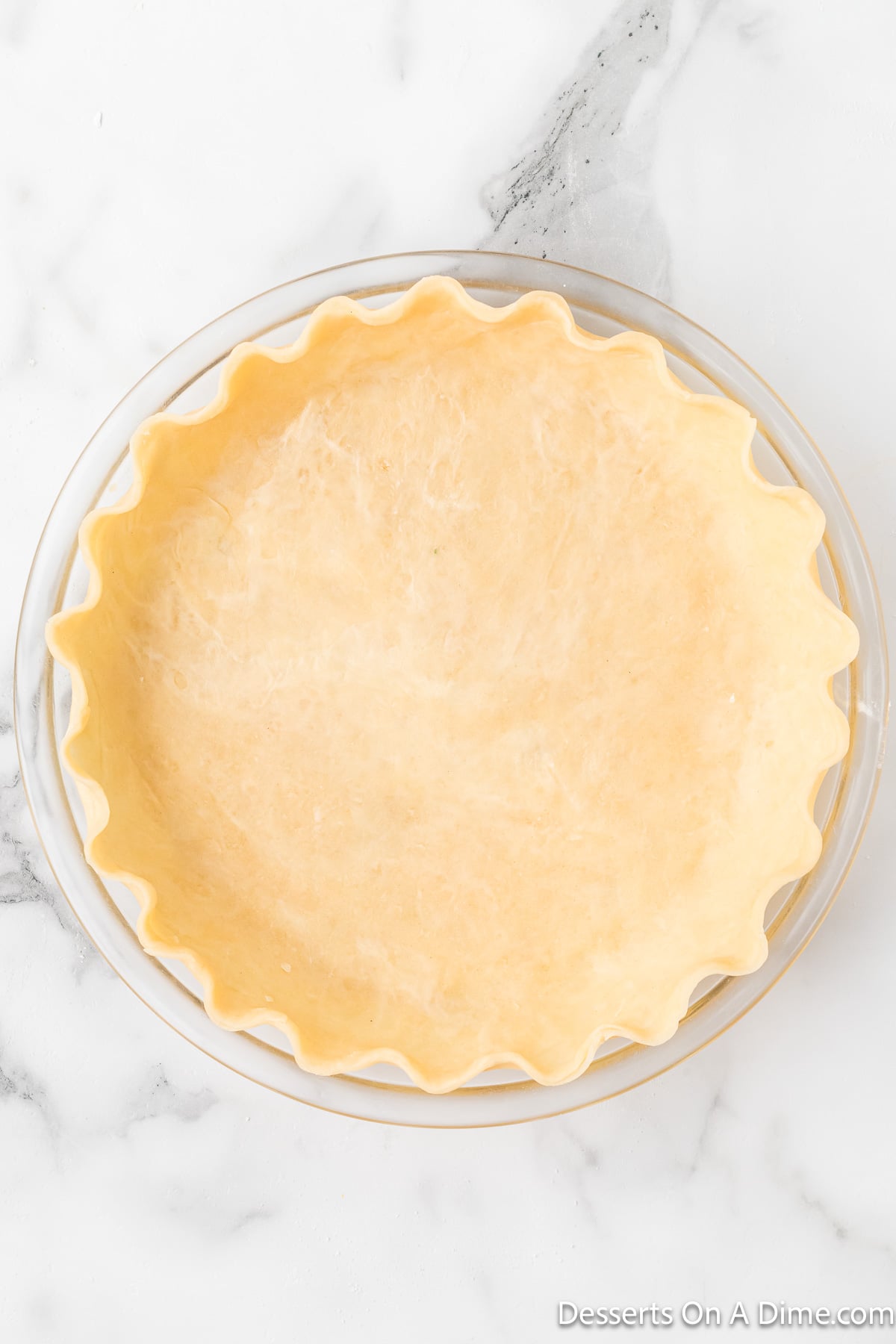 Dough trimmed and edges crimped. 