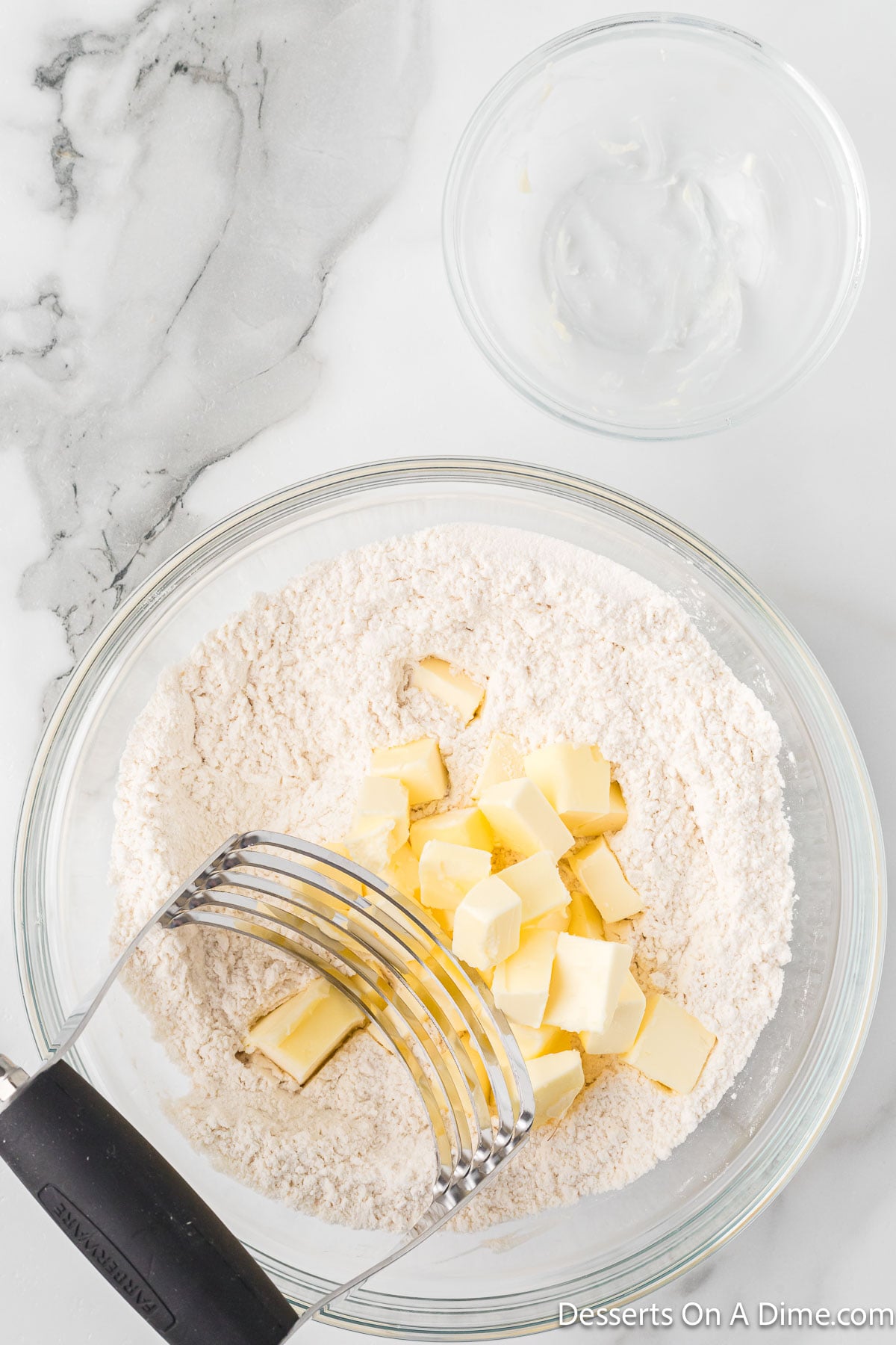 Butter diced into flour mixture. 