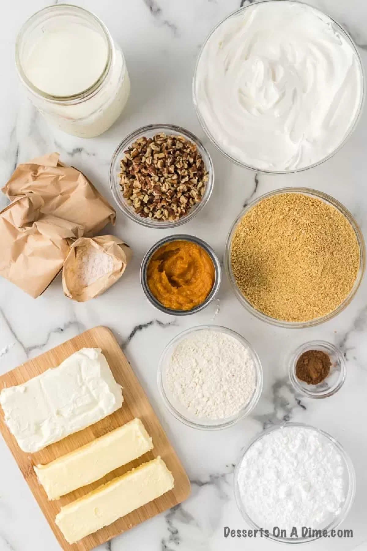 Ingredients needed for pumpkin delight: pudding mix, cream cheese, graham crackers, nuts, whipped cream, milk, pumpkin pie, powdered sugar. 