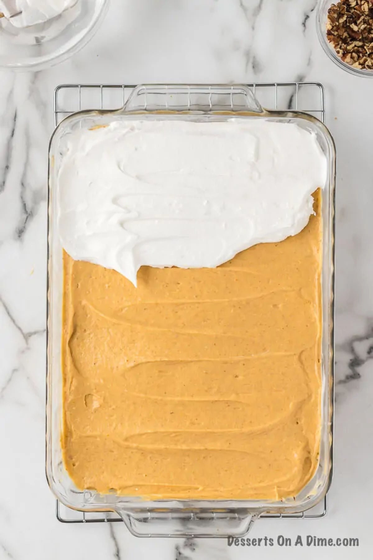 Spreading the mixture over the crust and top with whipped topping