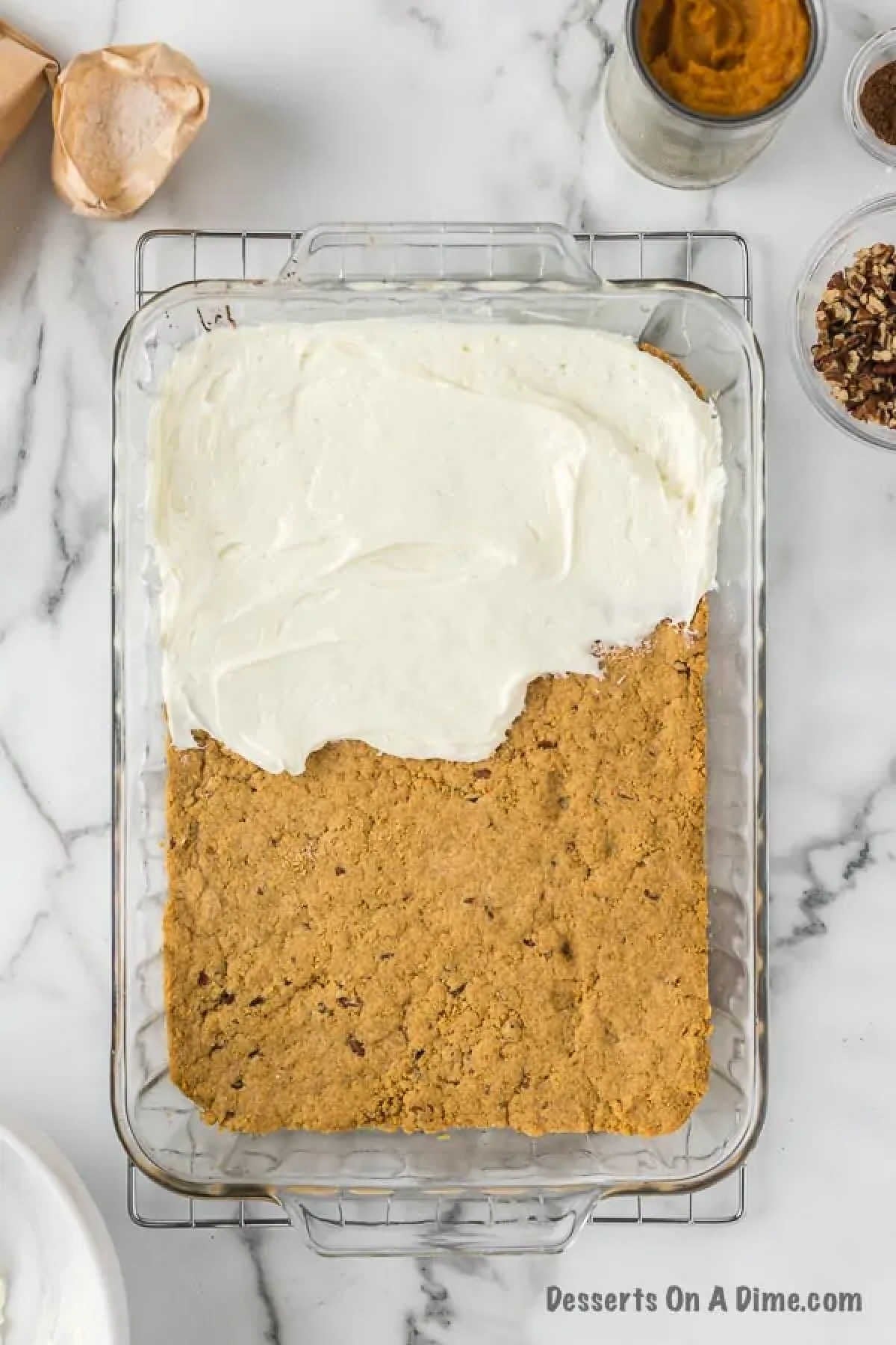 Spreading the cream cheese mixture on the crust