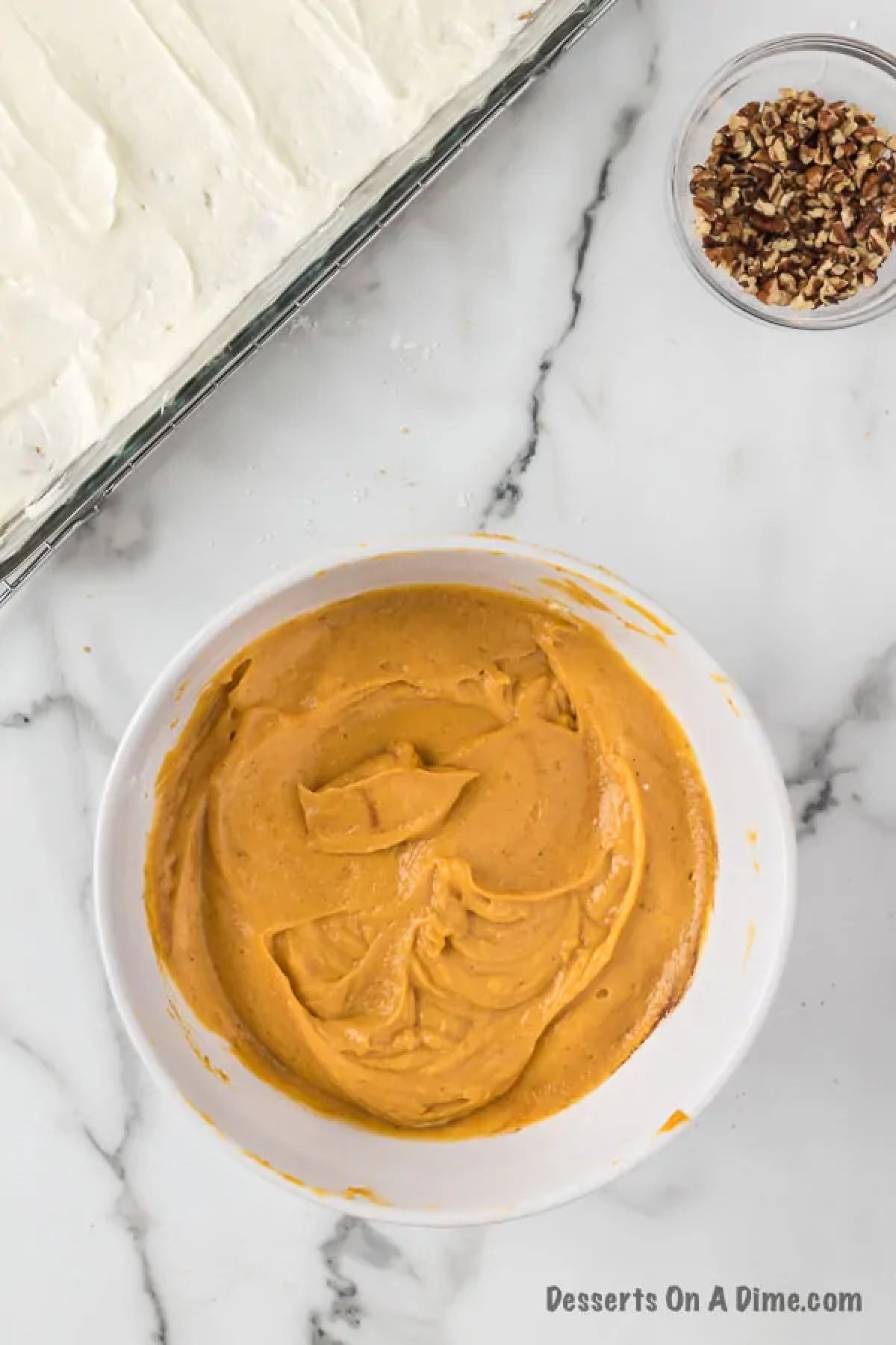 Mixing the pumpkin layer mixture in a bowl