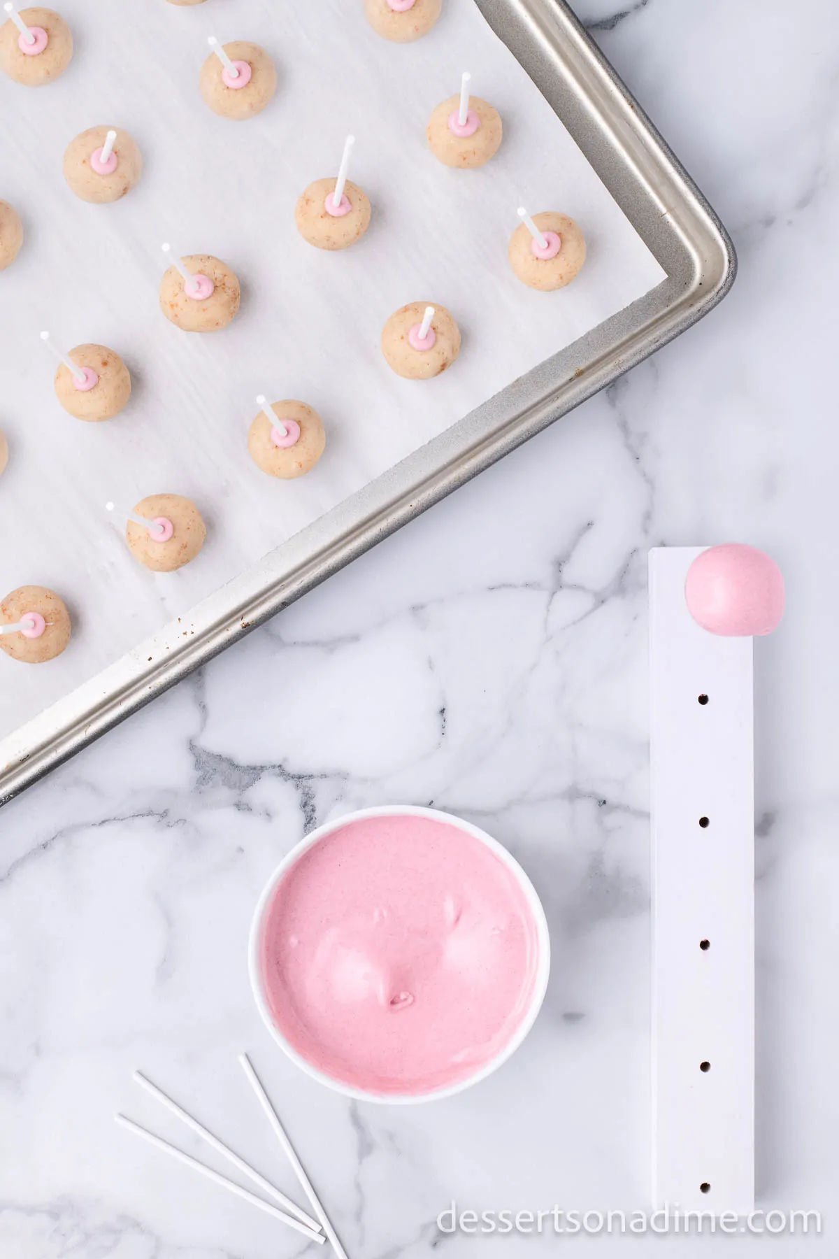 Cake pops dipped and placed in stand. 