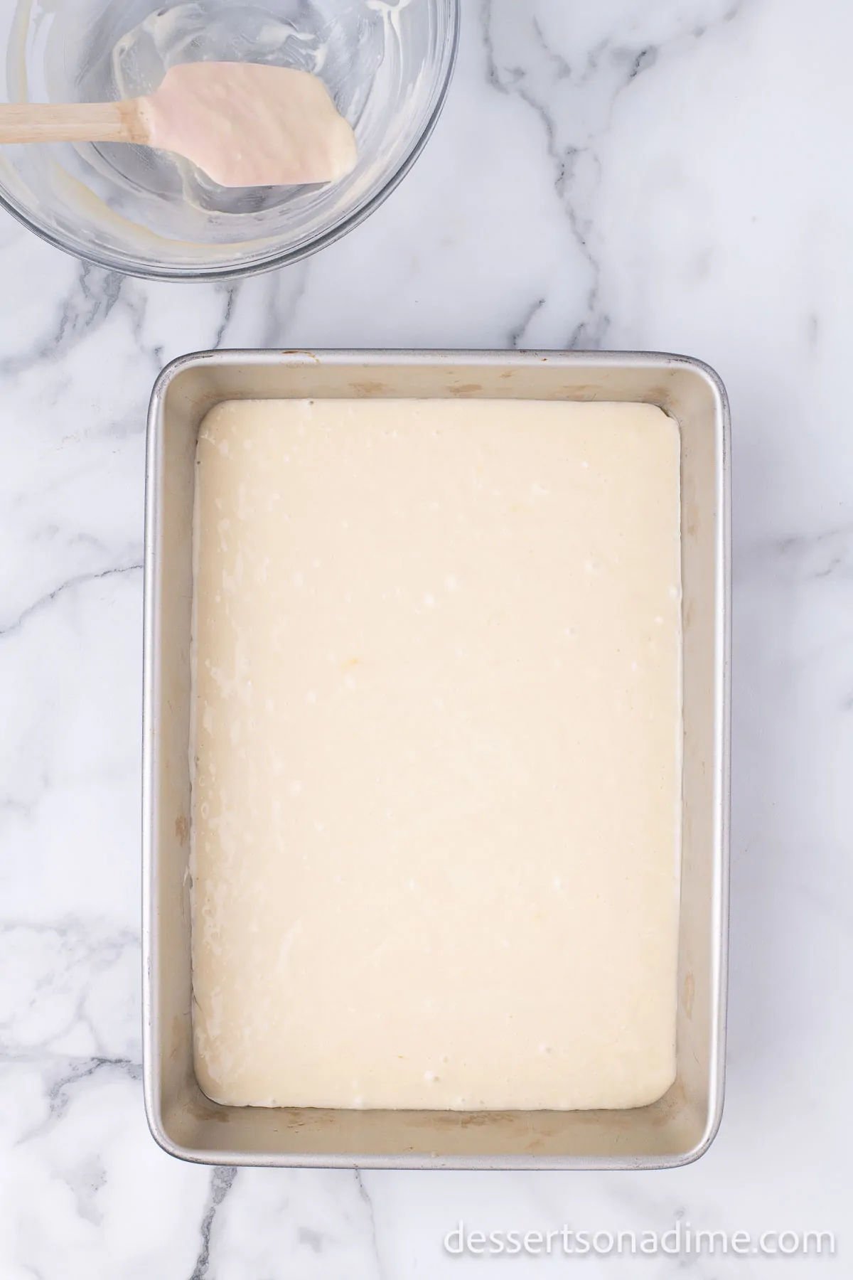 Cake batter in baking pan. 