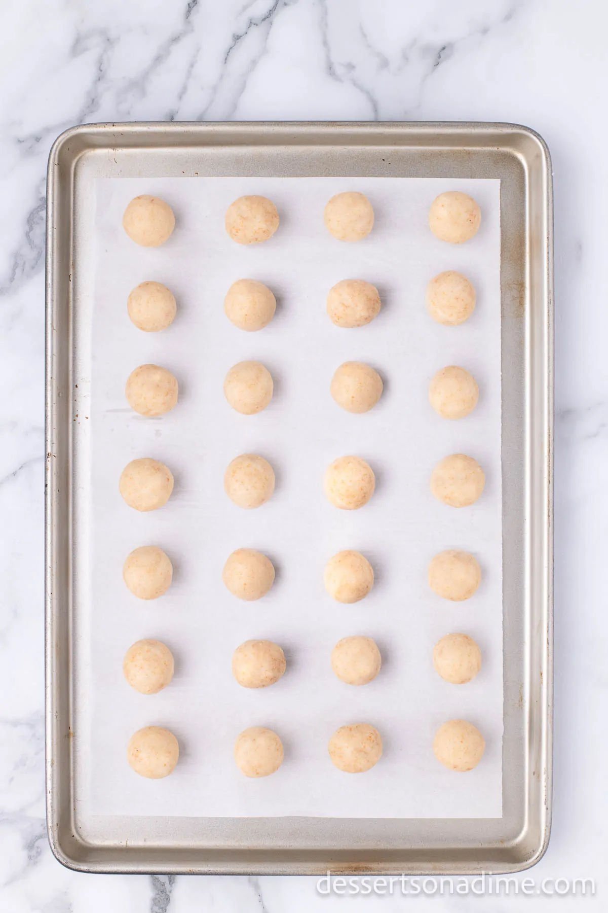 Cake balls on baking sheet. 