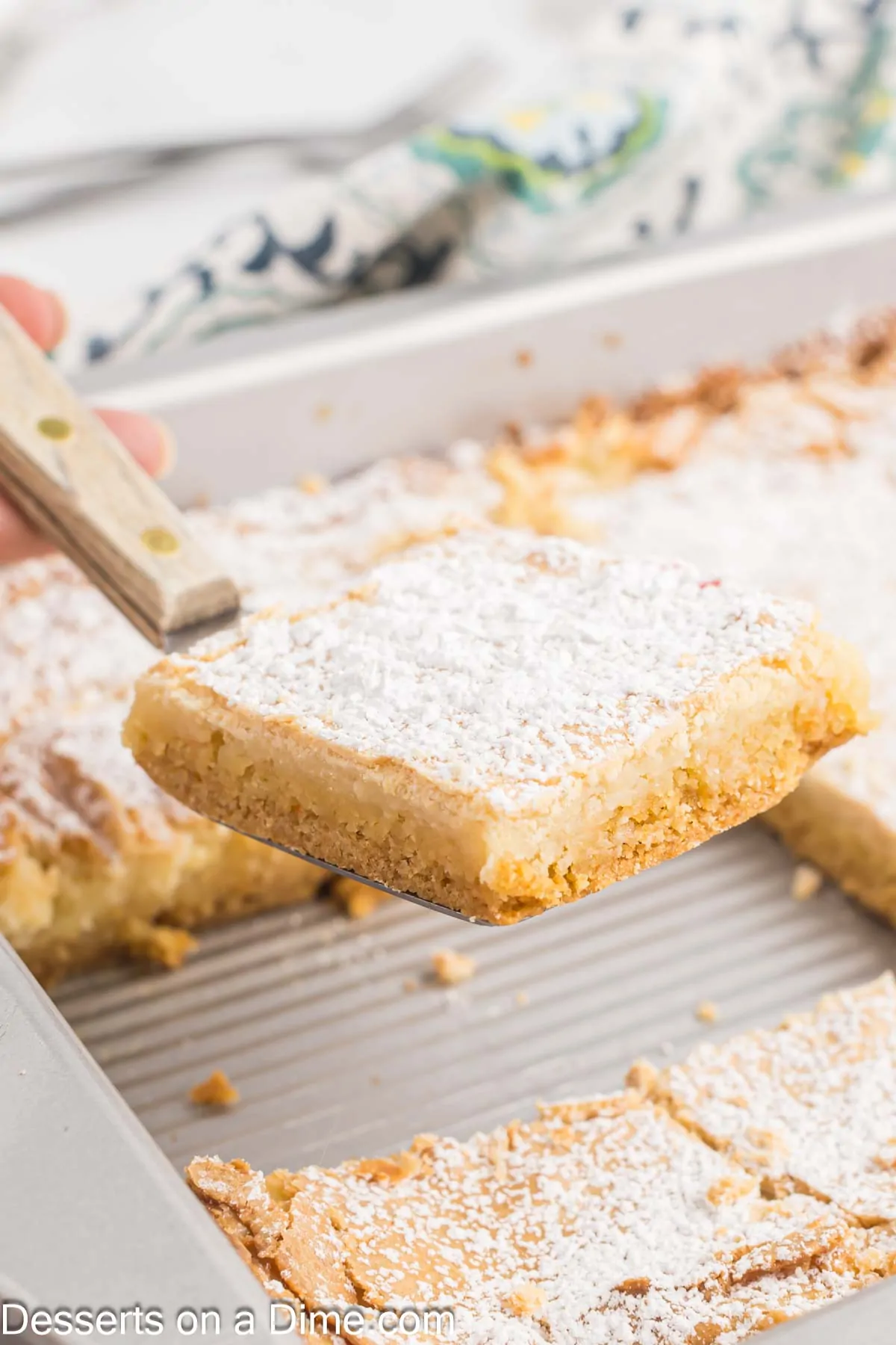Ooey Gooey Butter Cake cut into squares.