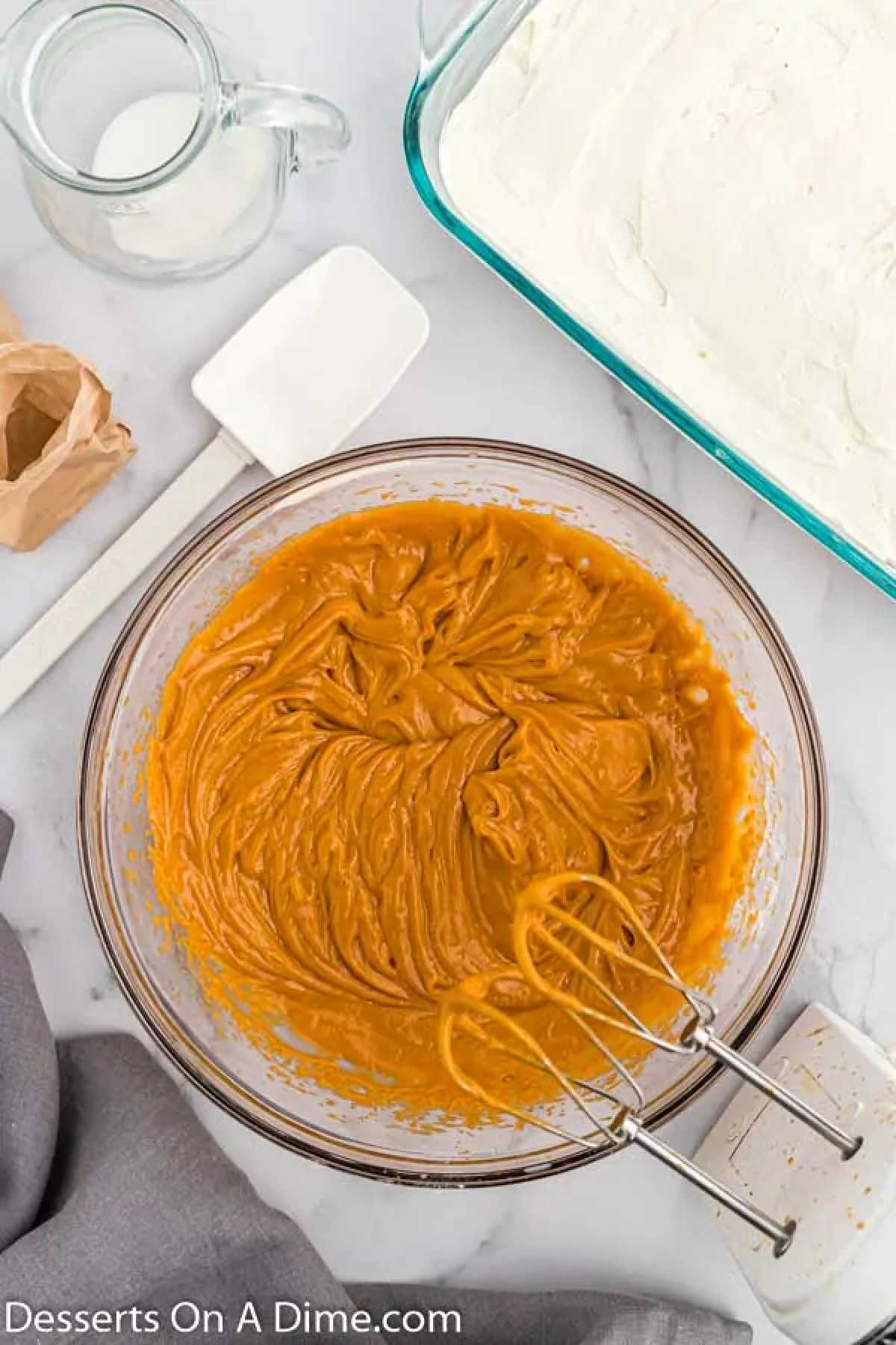 Butterscotch layer combined in mixing bowl.