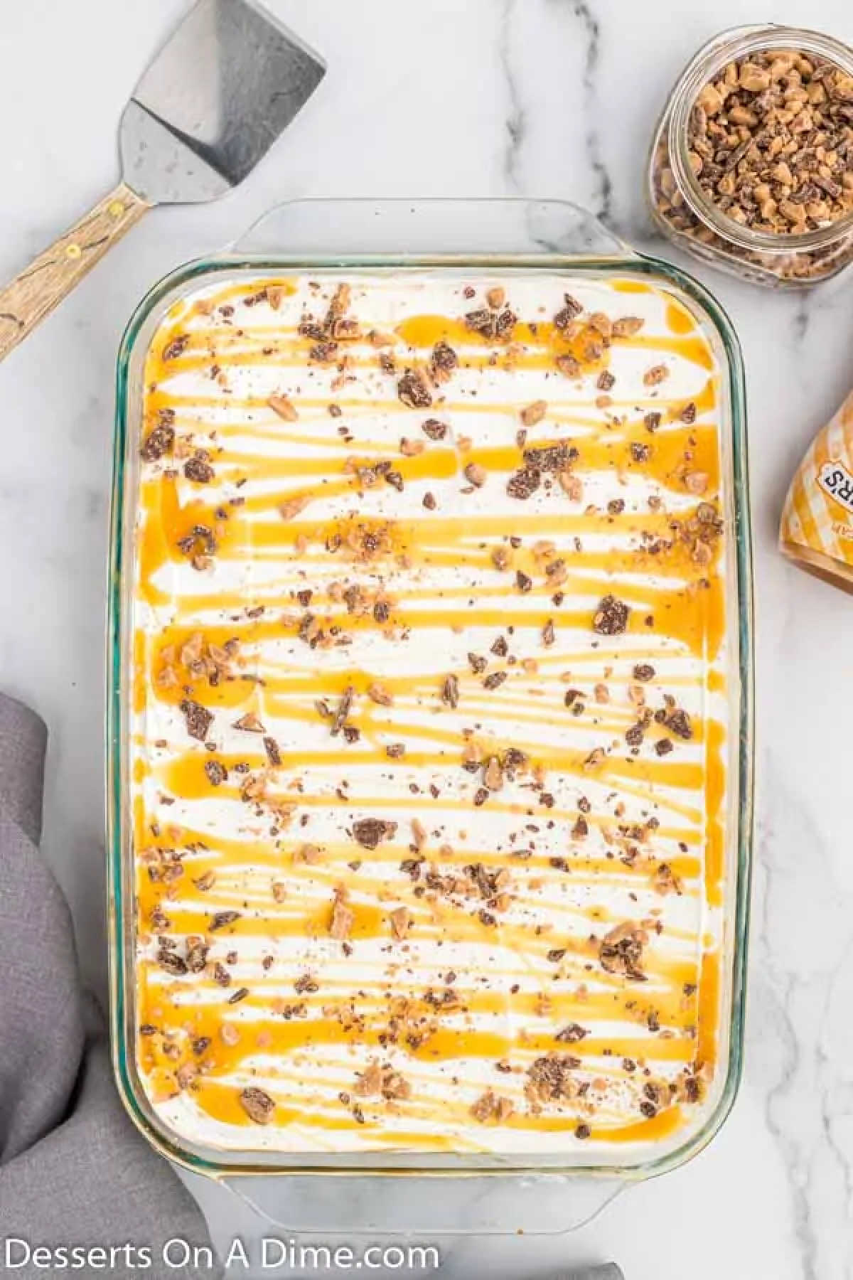 Cool whip, candy and butterscotch spread on top.