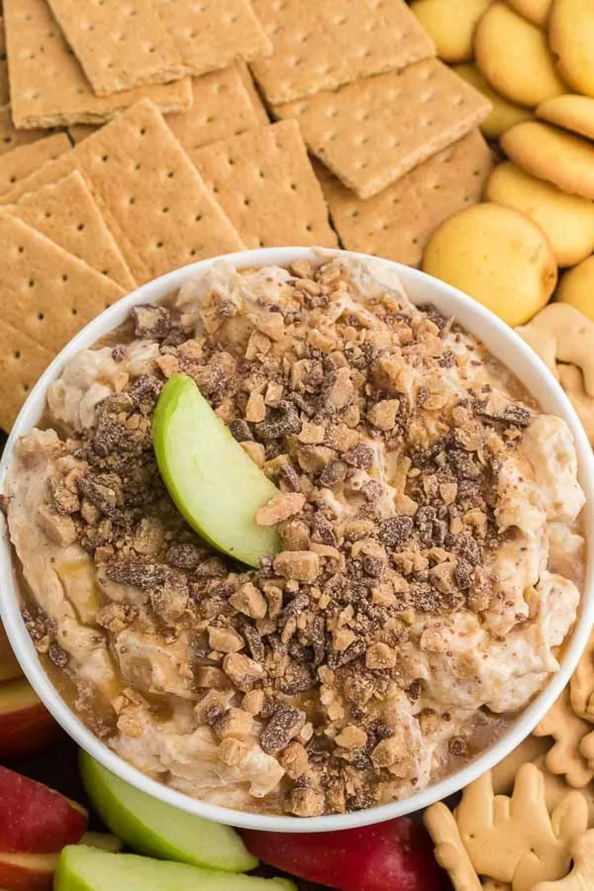 Caramel apple cheesecake dip in a bowl.
