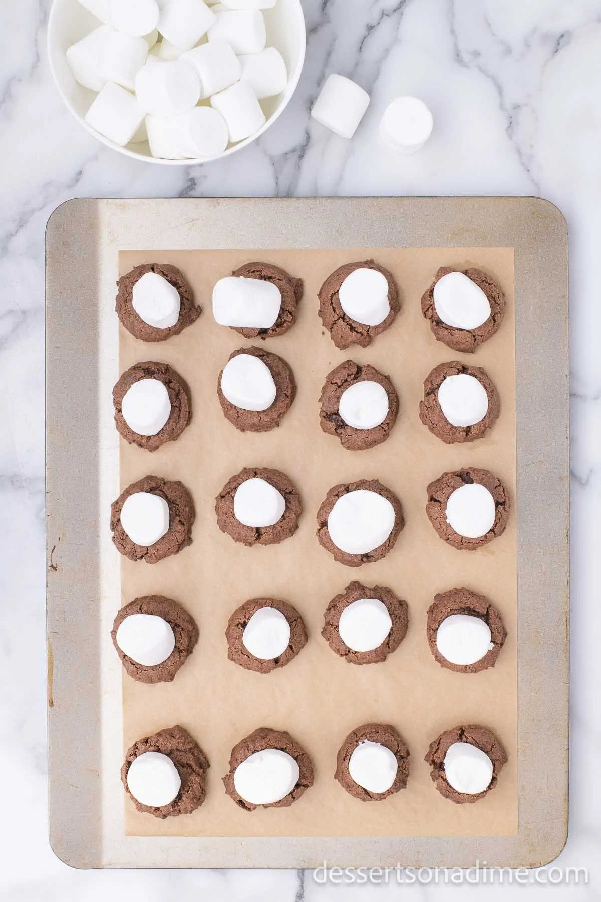 Marshmallows on each cookie.