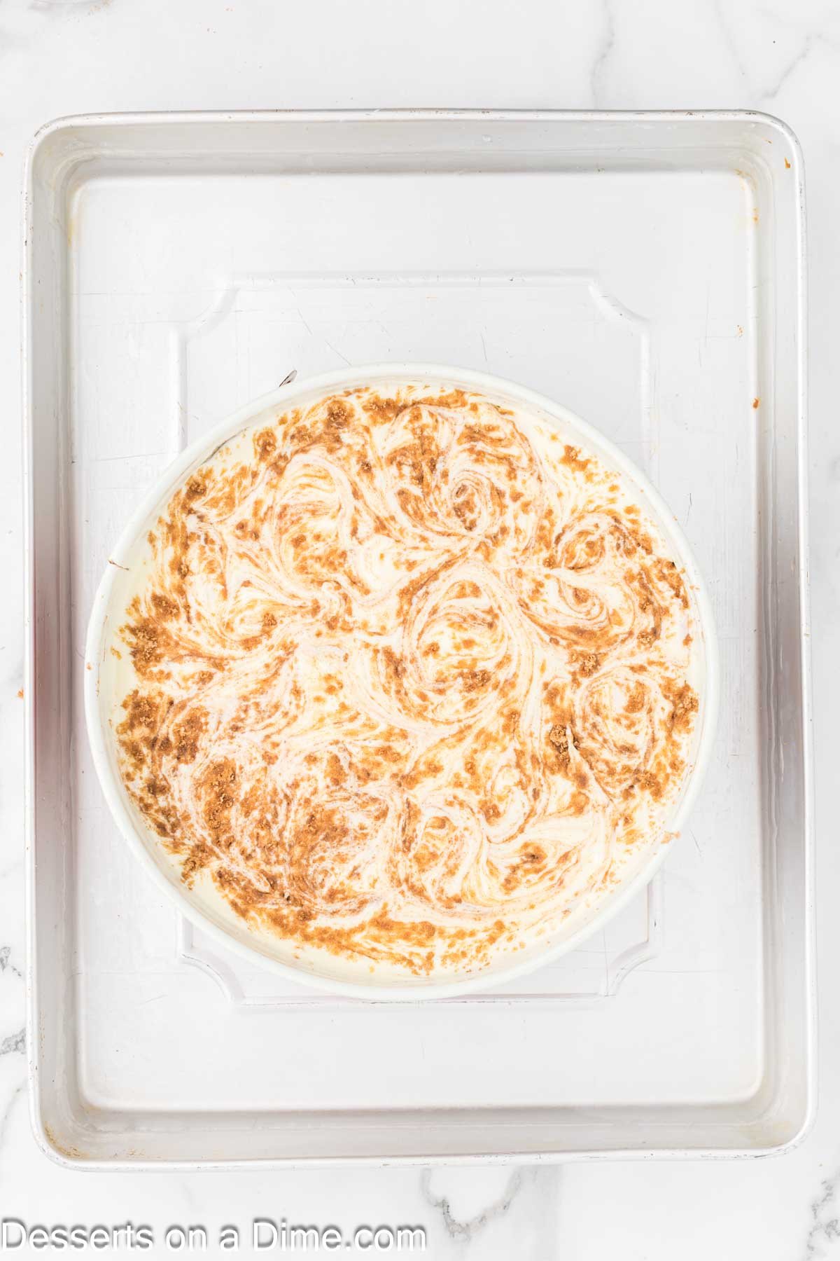 Cinnamon and brown sugar swirled together with the cheesecake filling. 