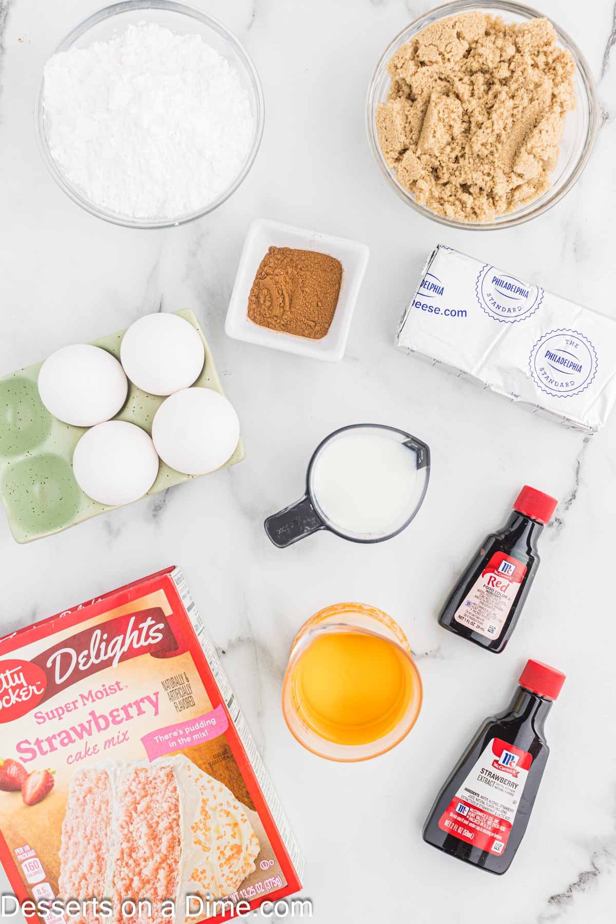 Ingredients for Strawberry Honey Bun Cake - Strawberry cake mix, eggs, cream cheese, brown sugar, cinnamon, powdered sugar, milk, strawberry extract, red food coloring. 