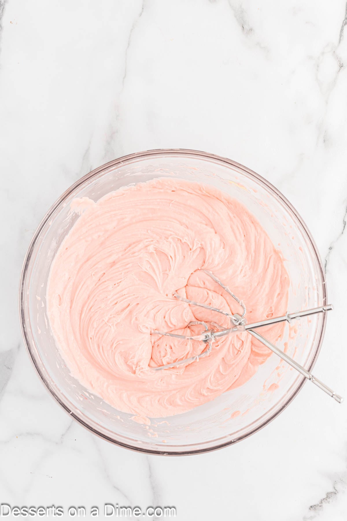 Bowl of cake mix cream cheese, eggs and vegetable oil. 