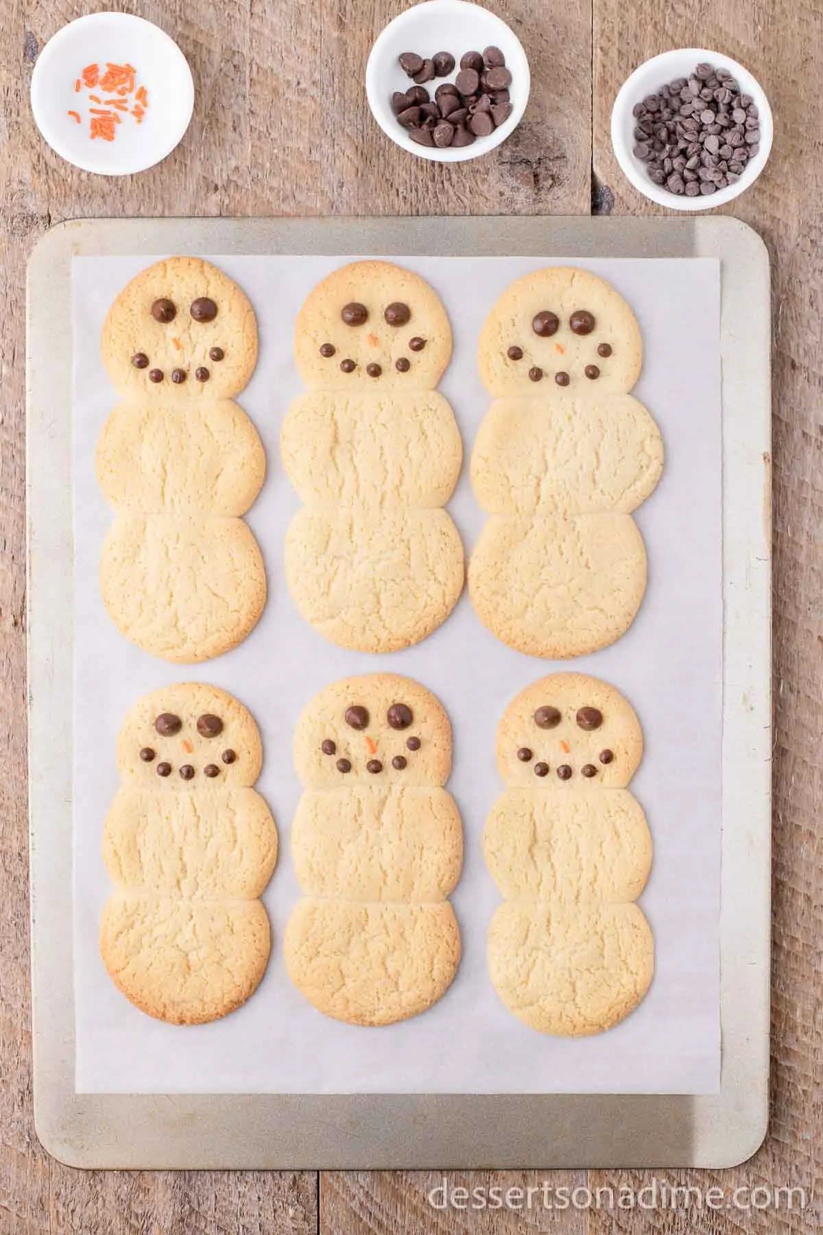 Cookies topped with eyes and mouth. 