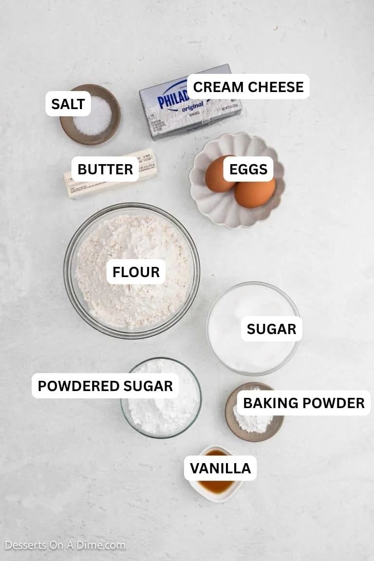 Ingredients for recipe: cream cheese, butter, eggs, vanilla, flour and powdered sugar. 