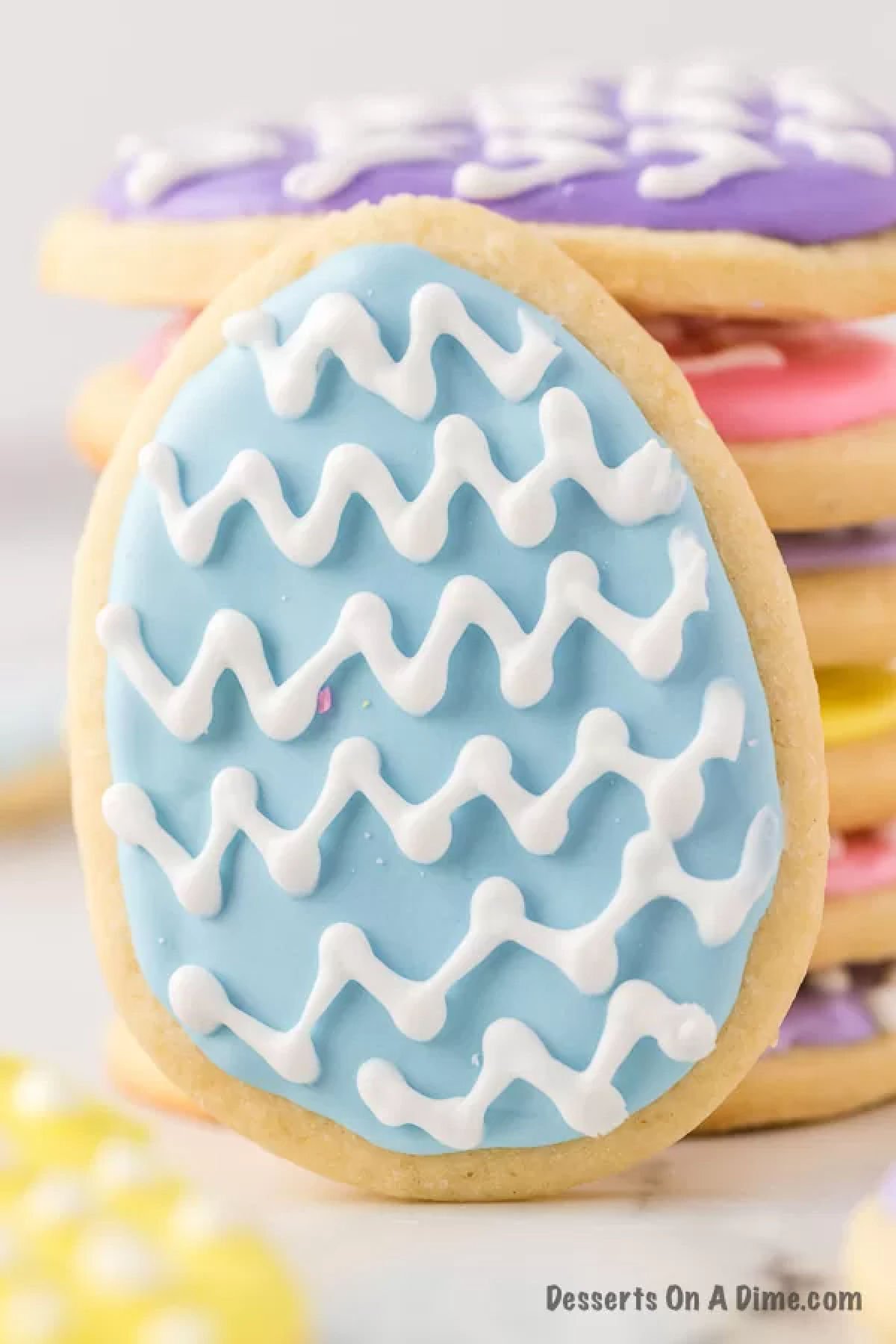 Stack of Easter egg Sugar Cookies decorated.