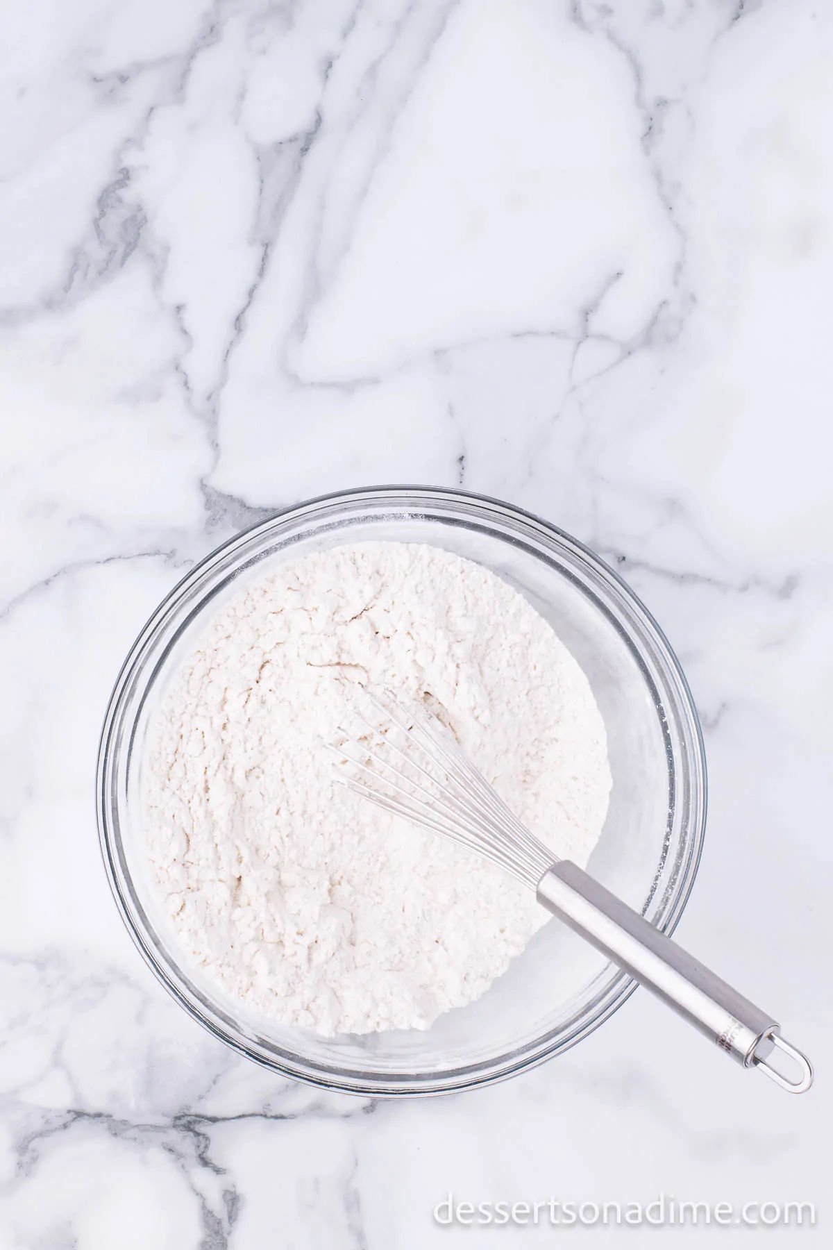 Dry ingredients combined together in a mixing bowl.