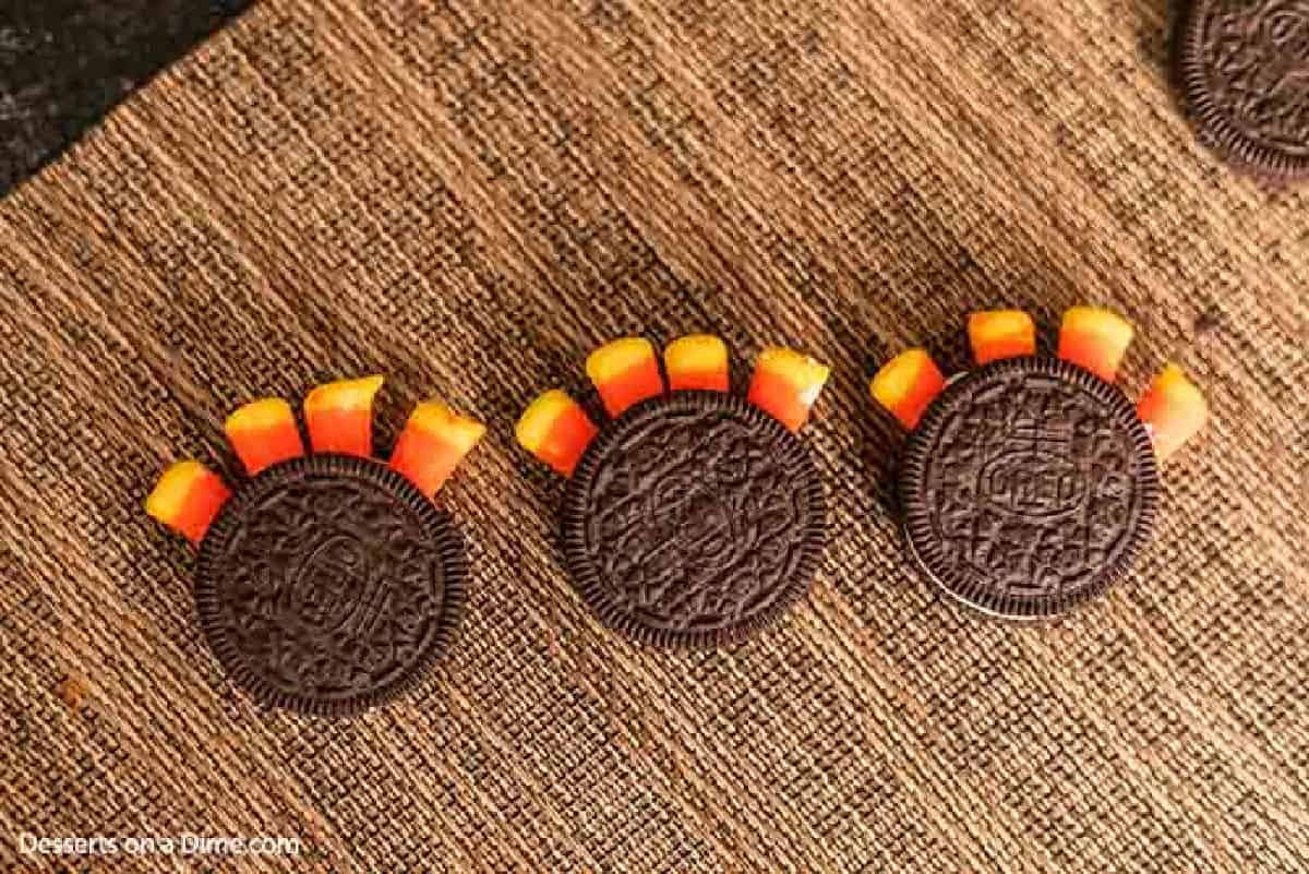 The tops of the Oreo Cookies placed back on top of the Candy Corns.
