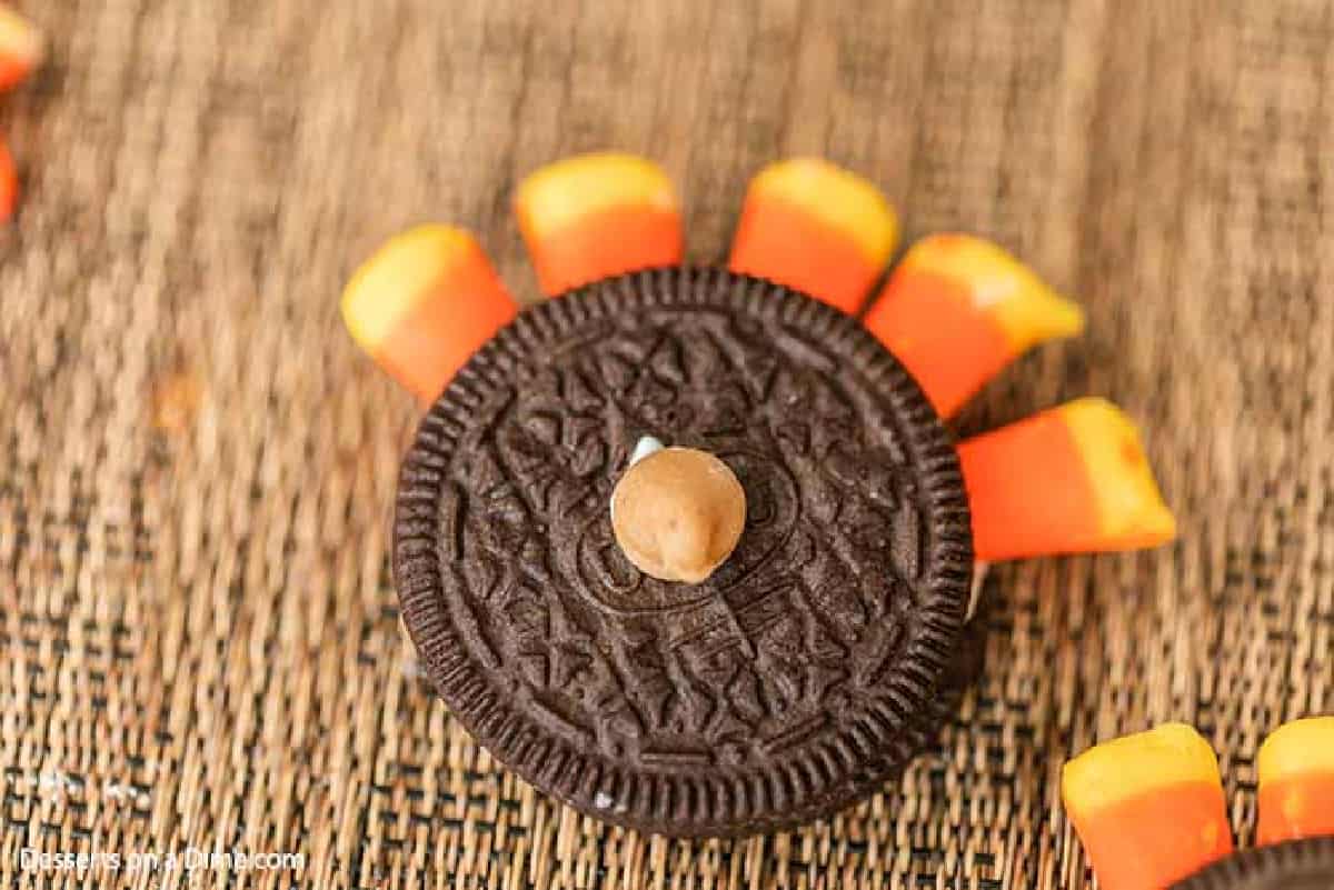 The peanut butter chip placed on the center of the Oreo as a nose.