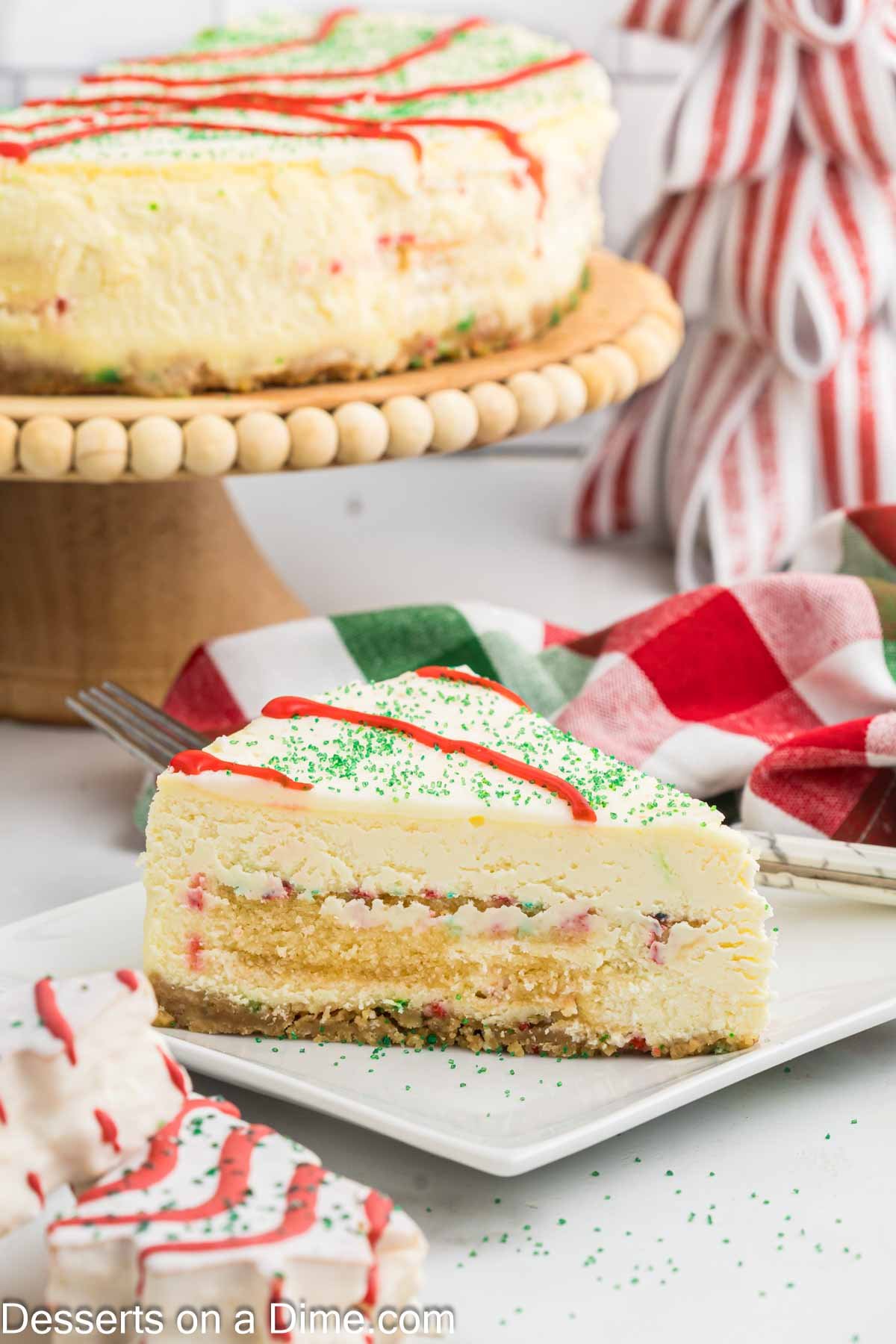 Little Debbie Christmas Tree Cheesecake sliced and served on a plate. 