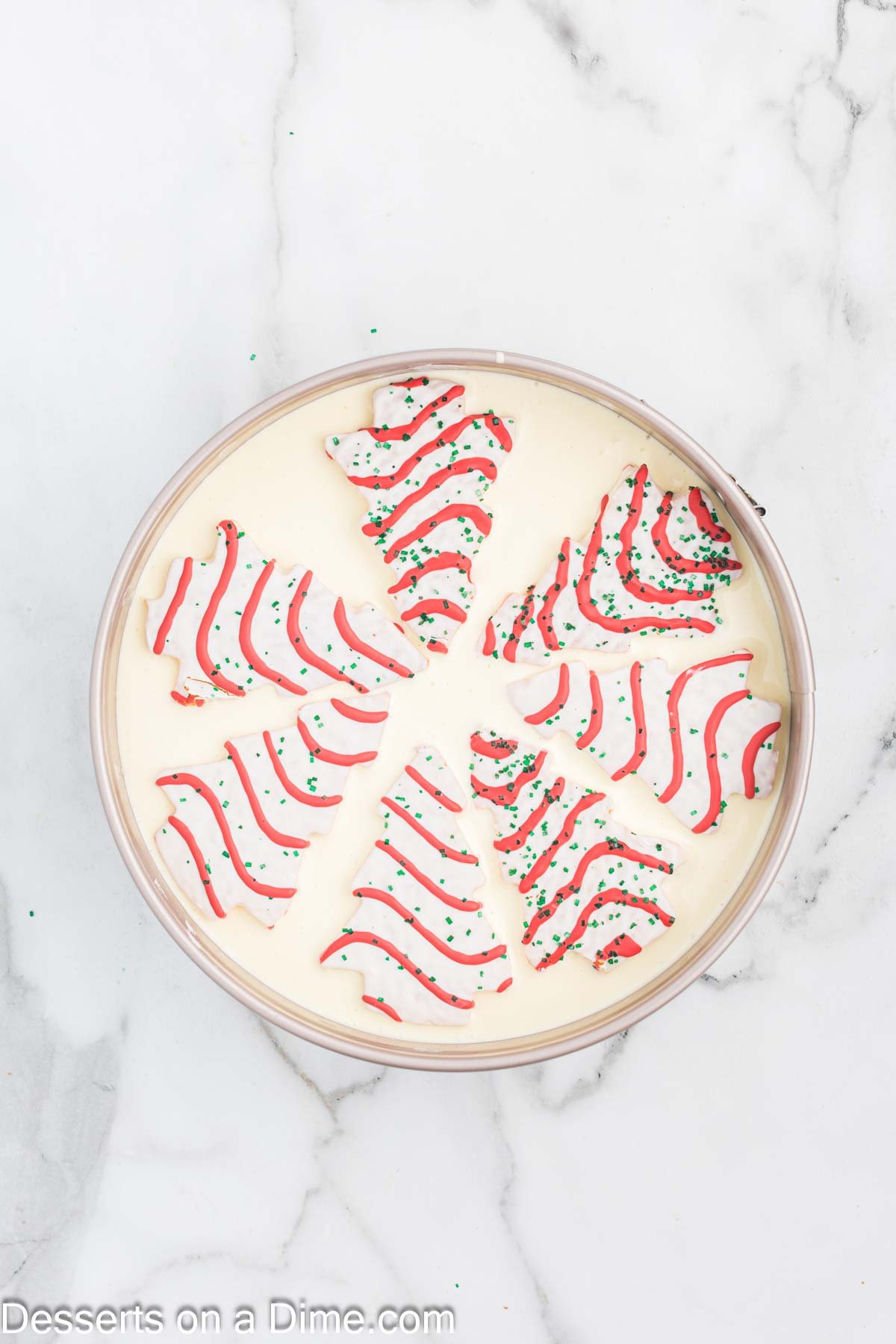 Little Debbie Trees placed on top of cheesecake batter. 