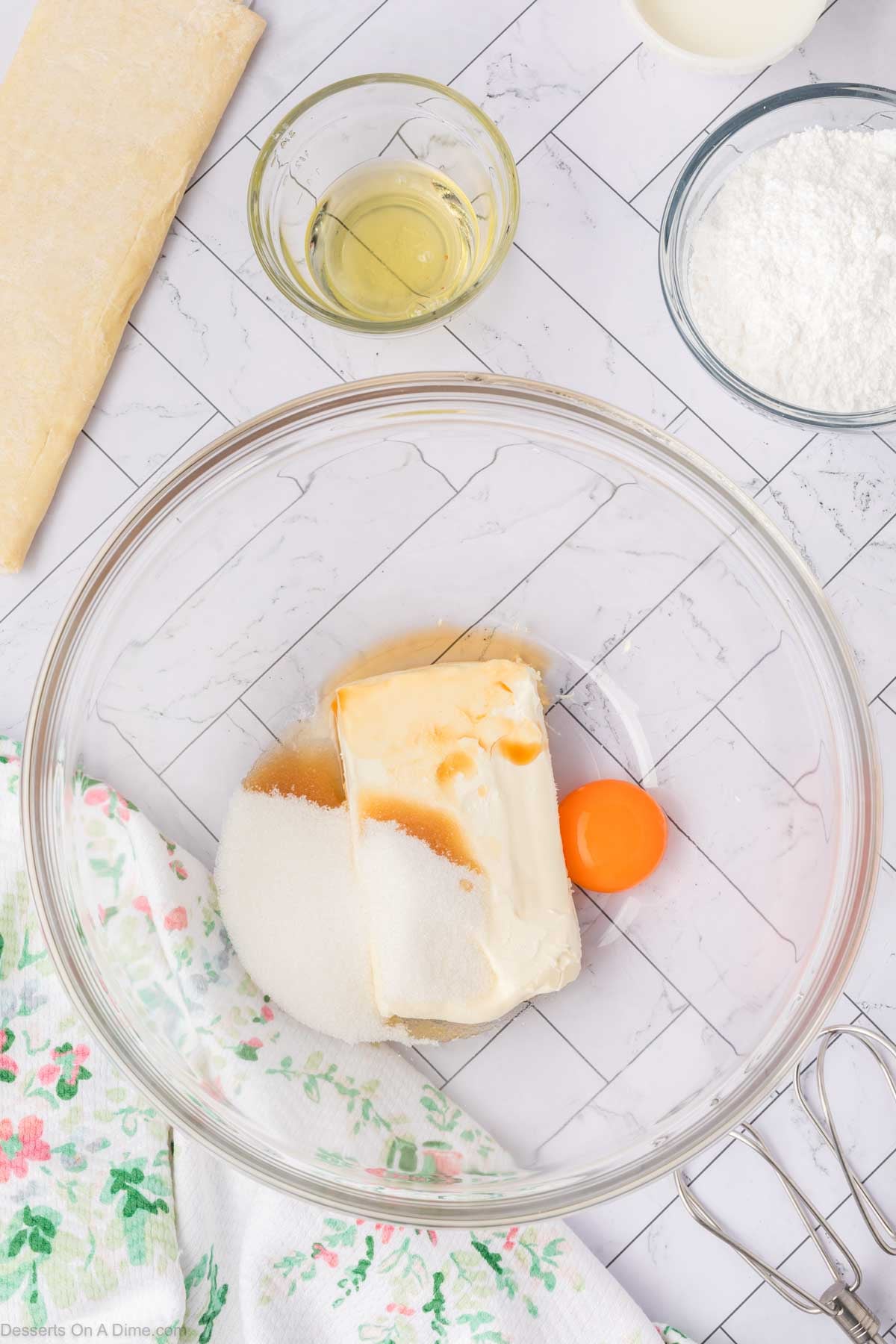 Cream cheese and egg in mixing bowl. 