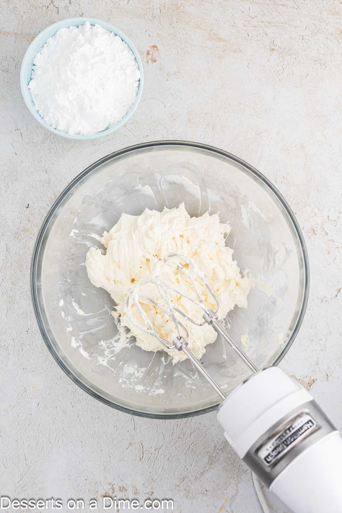 Butter and cream cheese beat together. 