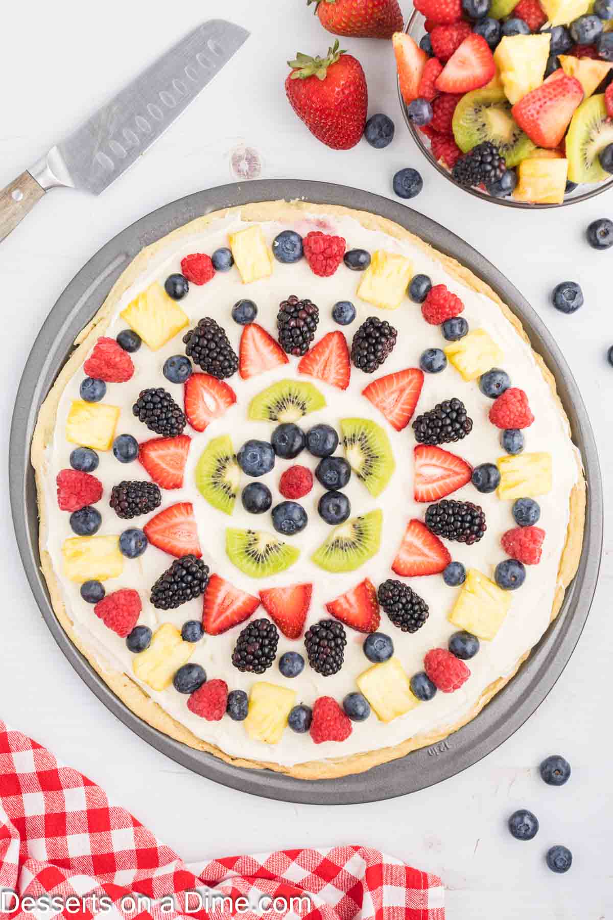 Fruit arranged on cookie crust.