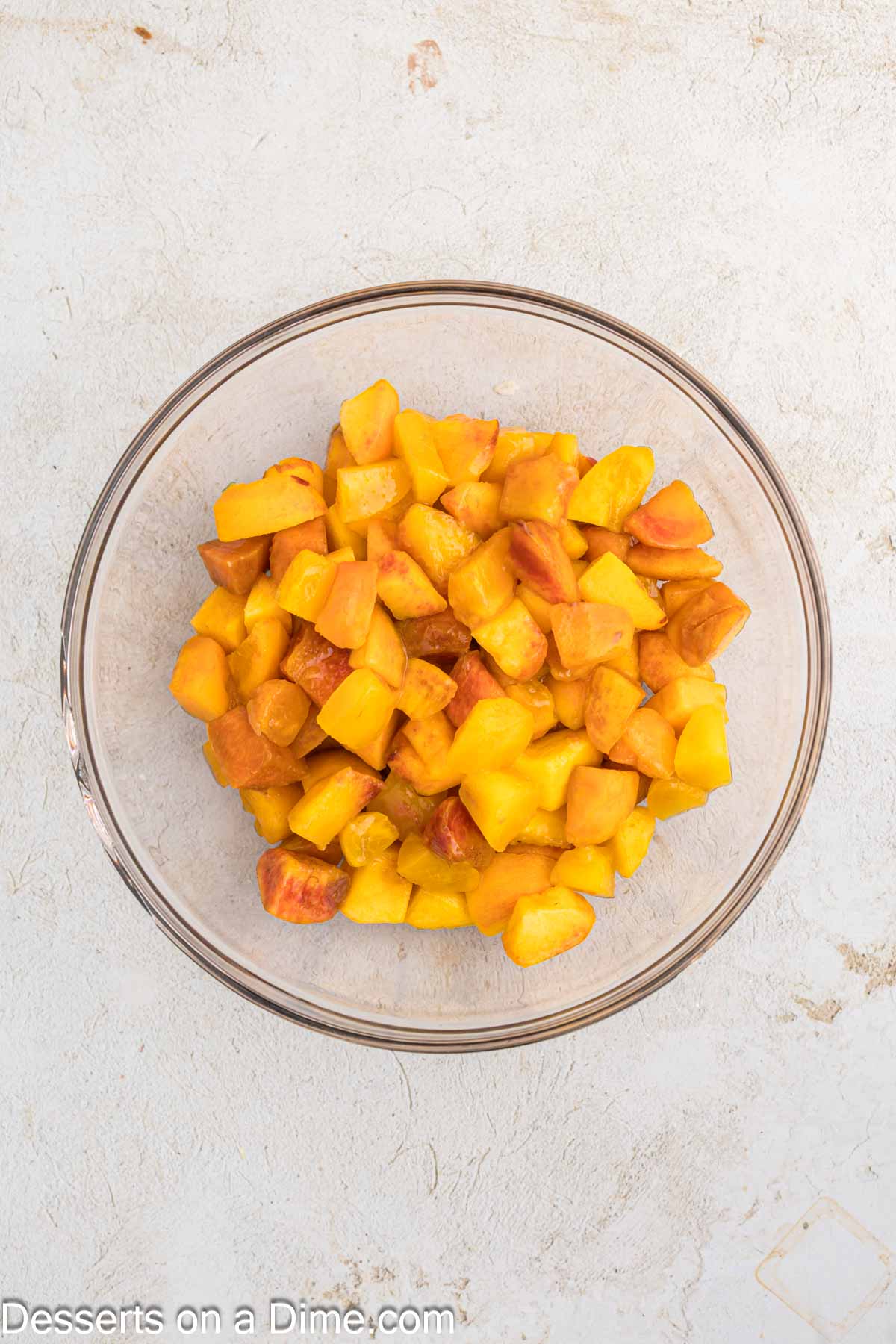 Diced peaches in a bowl. 