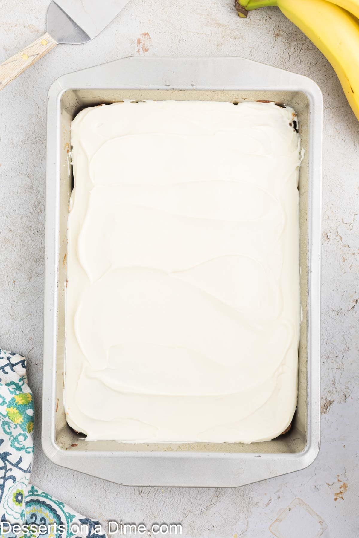 Cream cheese spread on cake. 