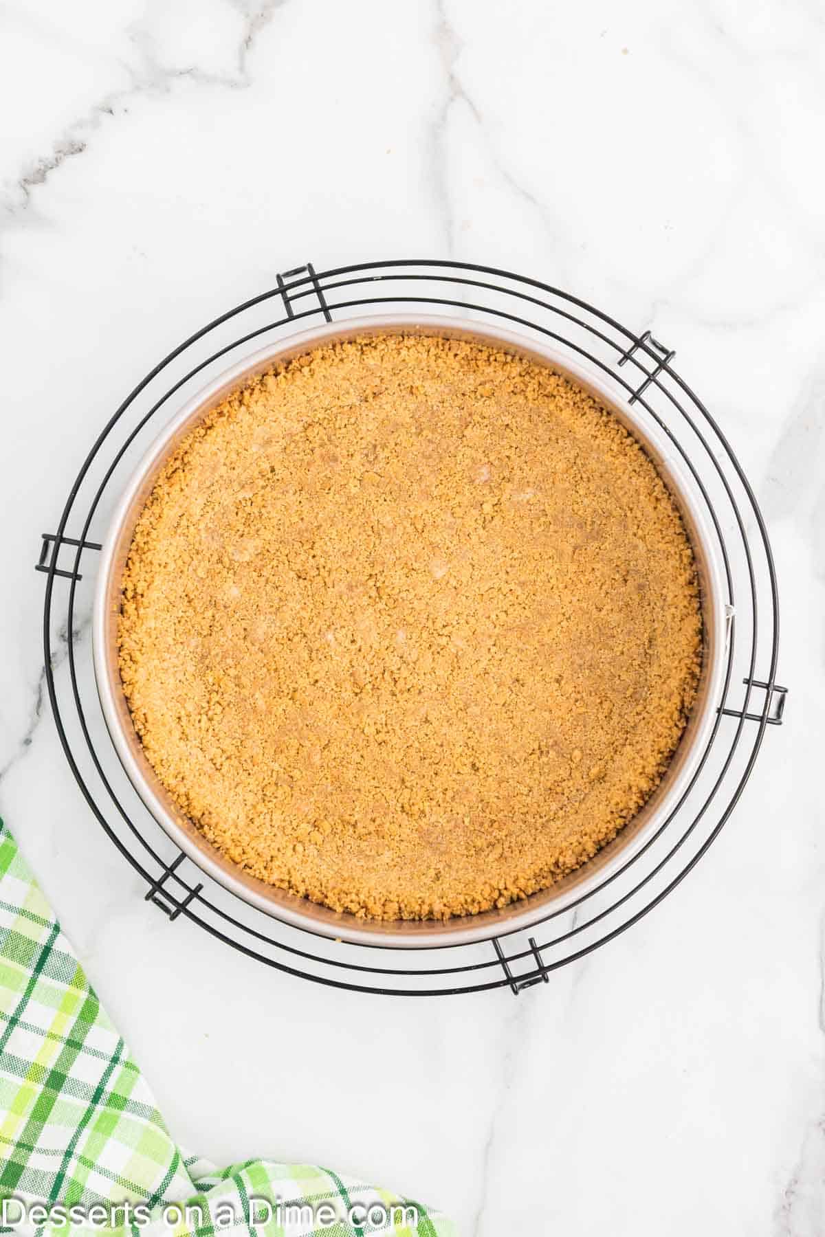 Graham cracker crust cooling. 