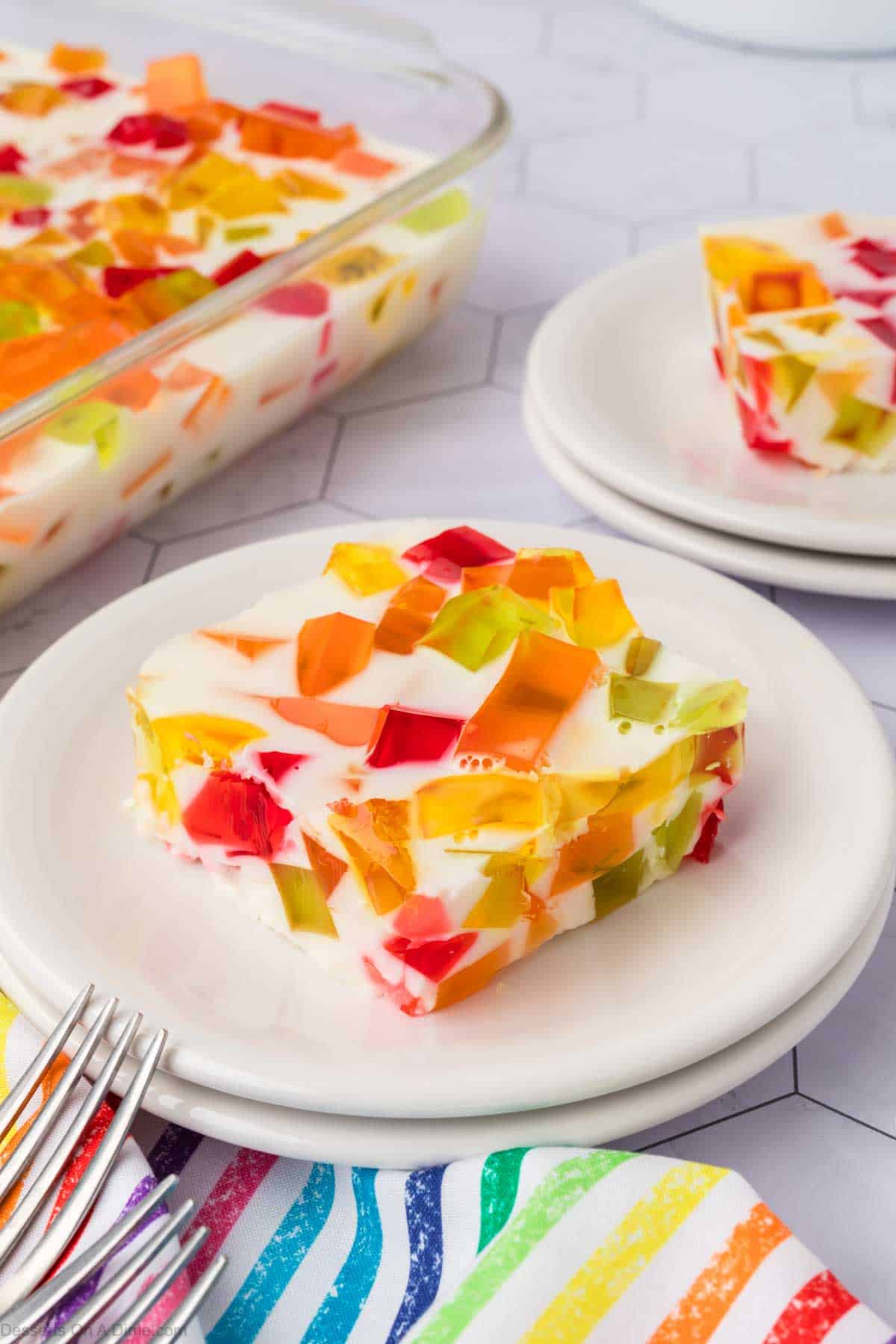 Slice of Broken Glass jello on white plate.