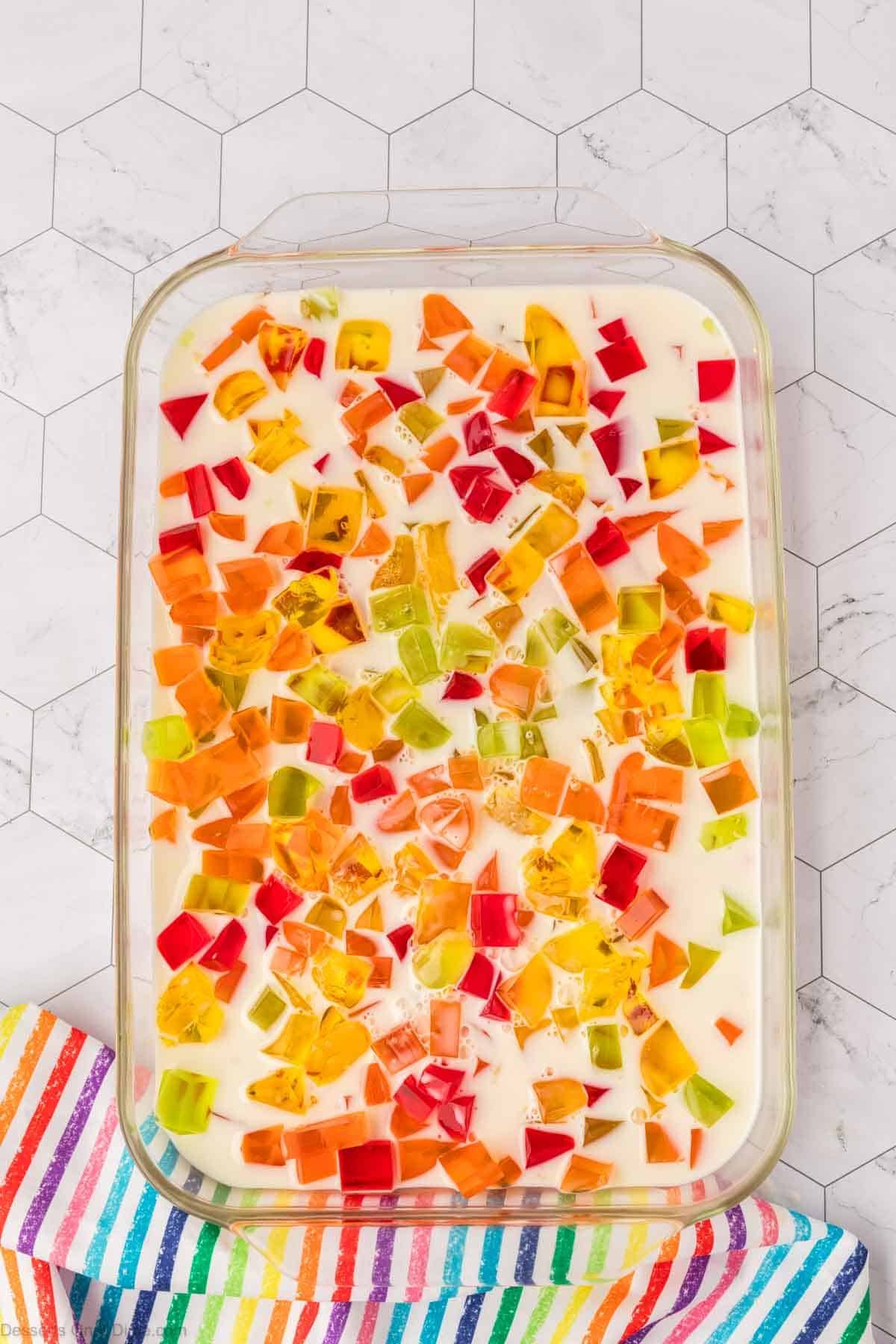 Cubes of jello in baking dish. 