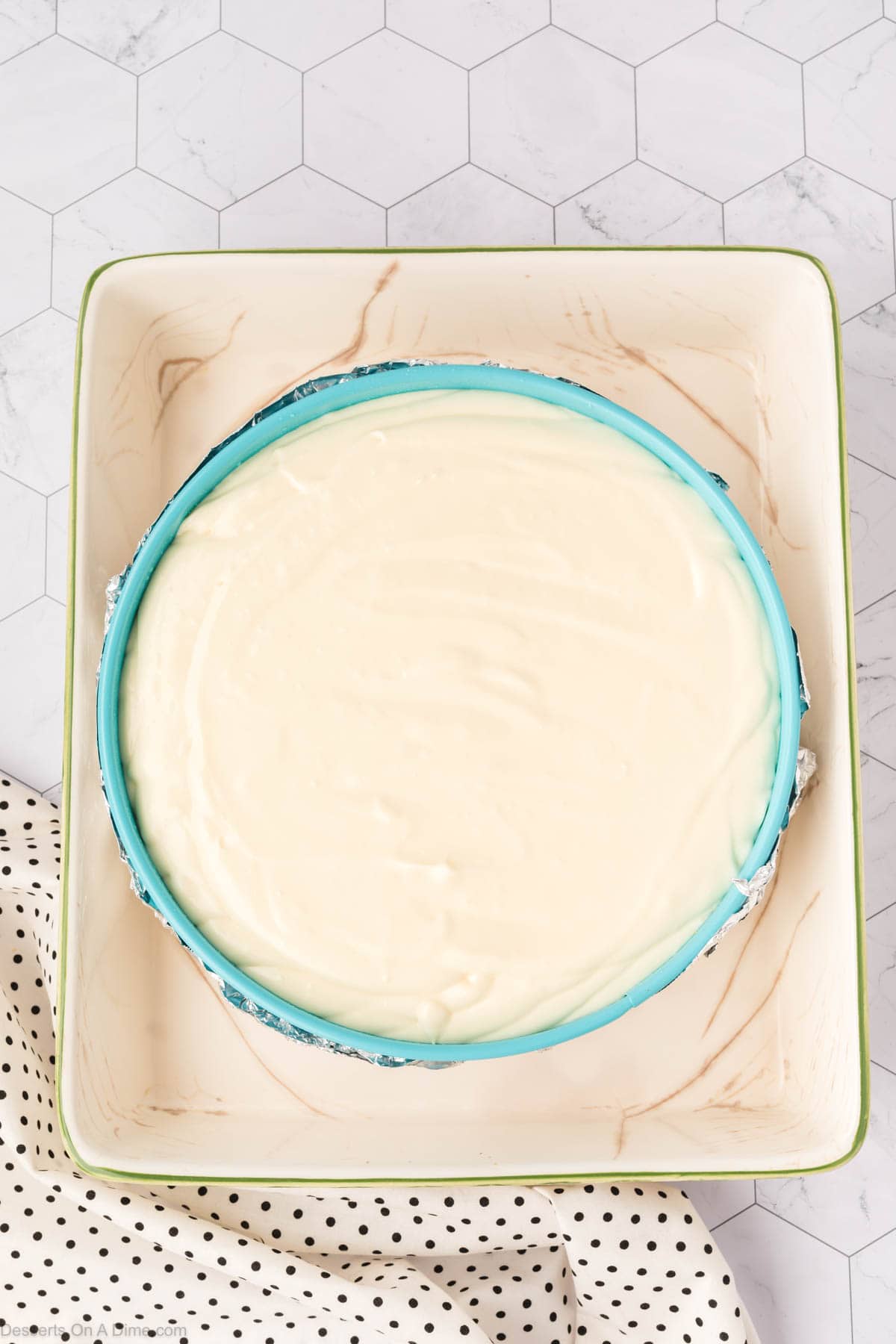 Cheesecake filling poured into pan.