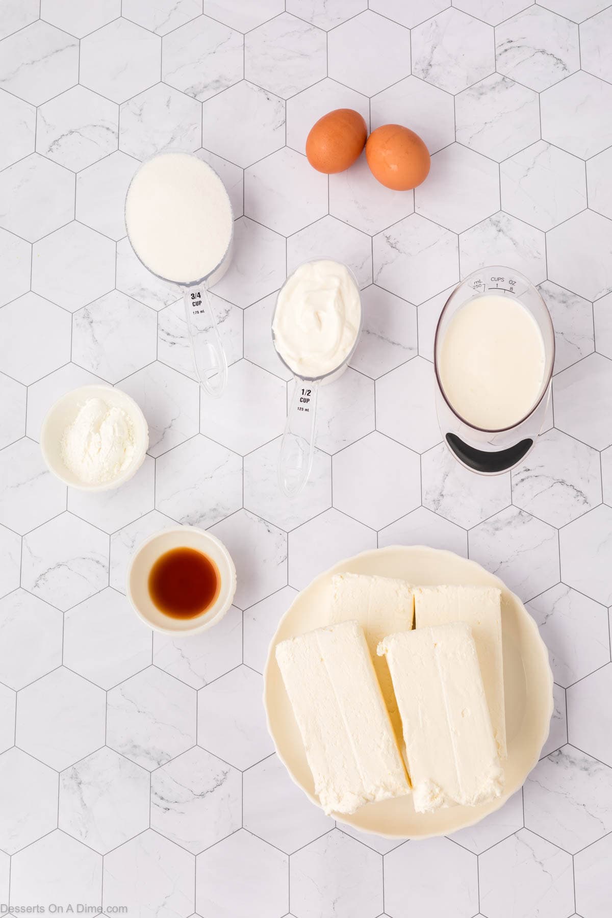 Ingredients for S'mores Cheesecake - graham cracker crumbs, brown sugar, butter, cream cheese, chocolate chips, mini marshmallows, sour cream. 