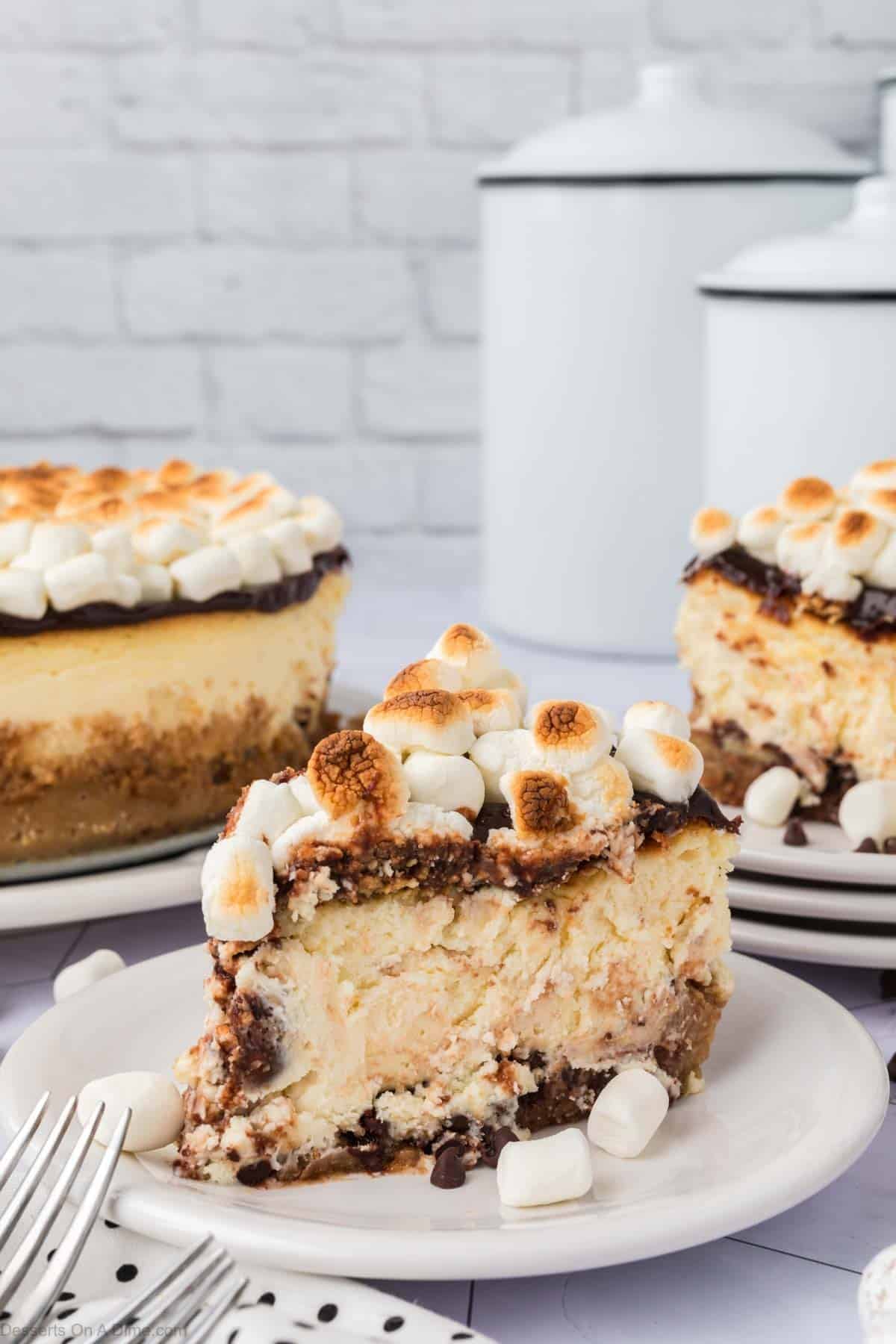 Slice of S'mores cheesecake on a plate.