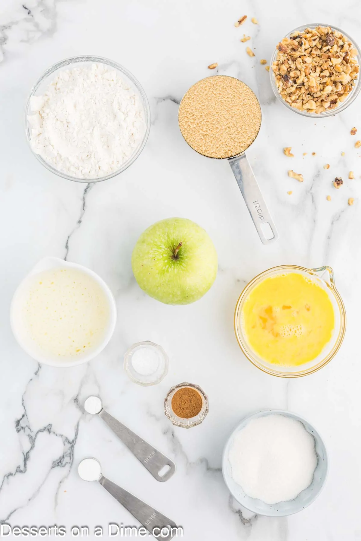 Ingredients for apple bread - apples, flour, sugar, nuts, butter.