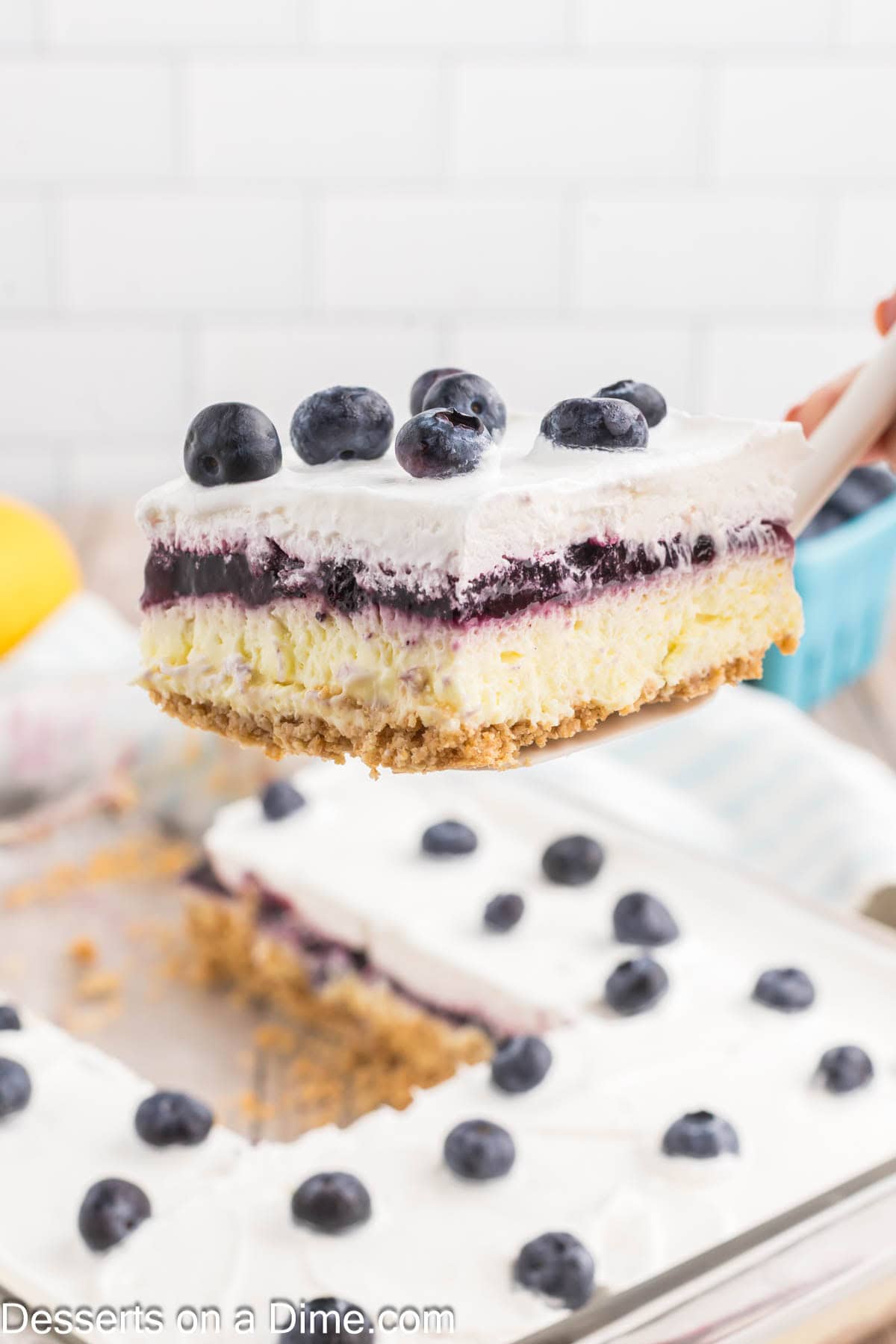 Lemon Blueberry Dessert being served.