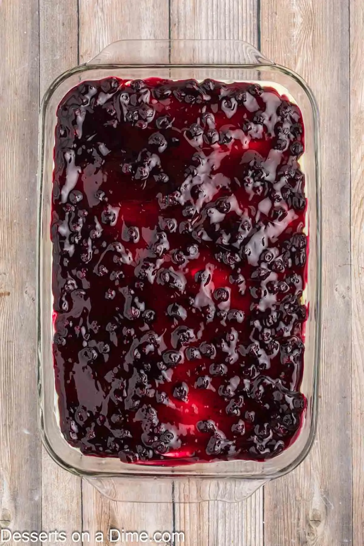 Blueberry pie filling spread over pan.