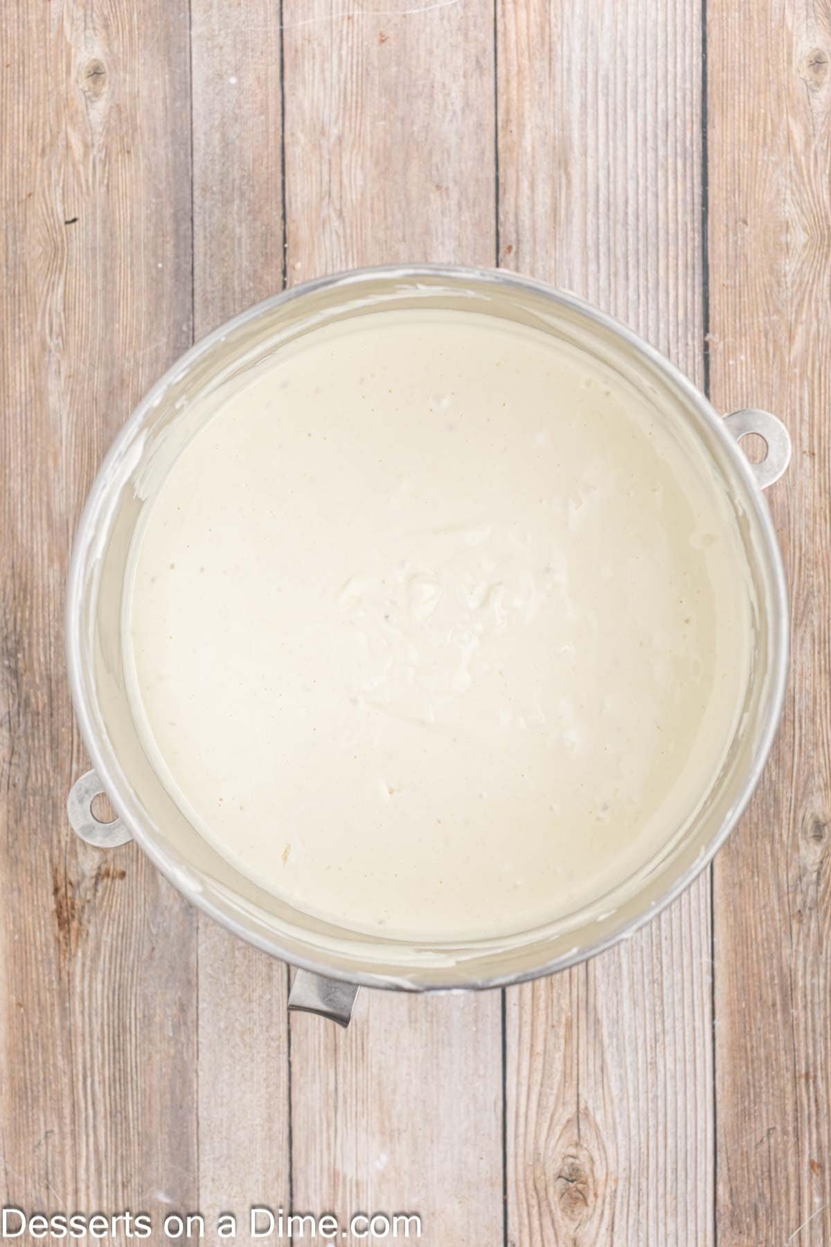 Cheesecake filling combined together in mixing bowl.