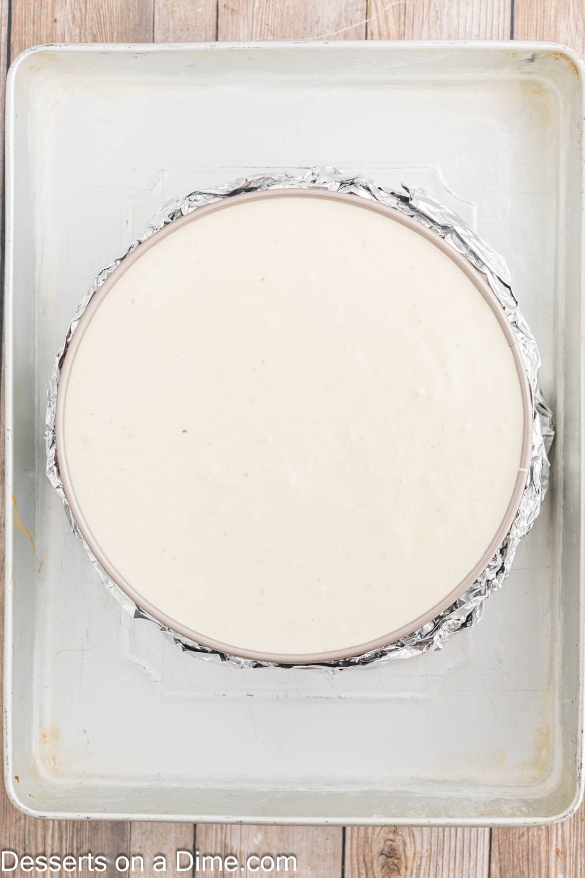 Cheesecake in pan in water bath.