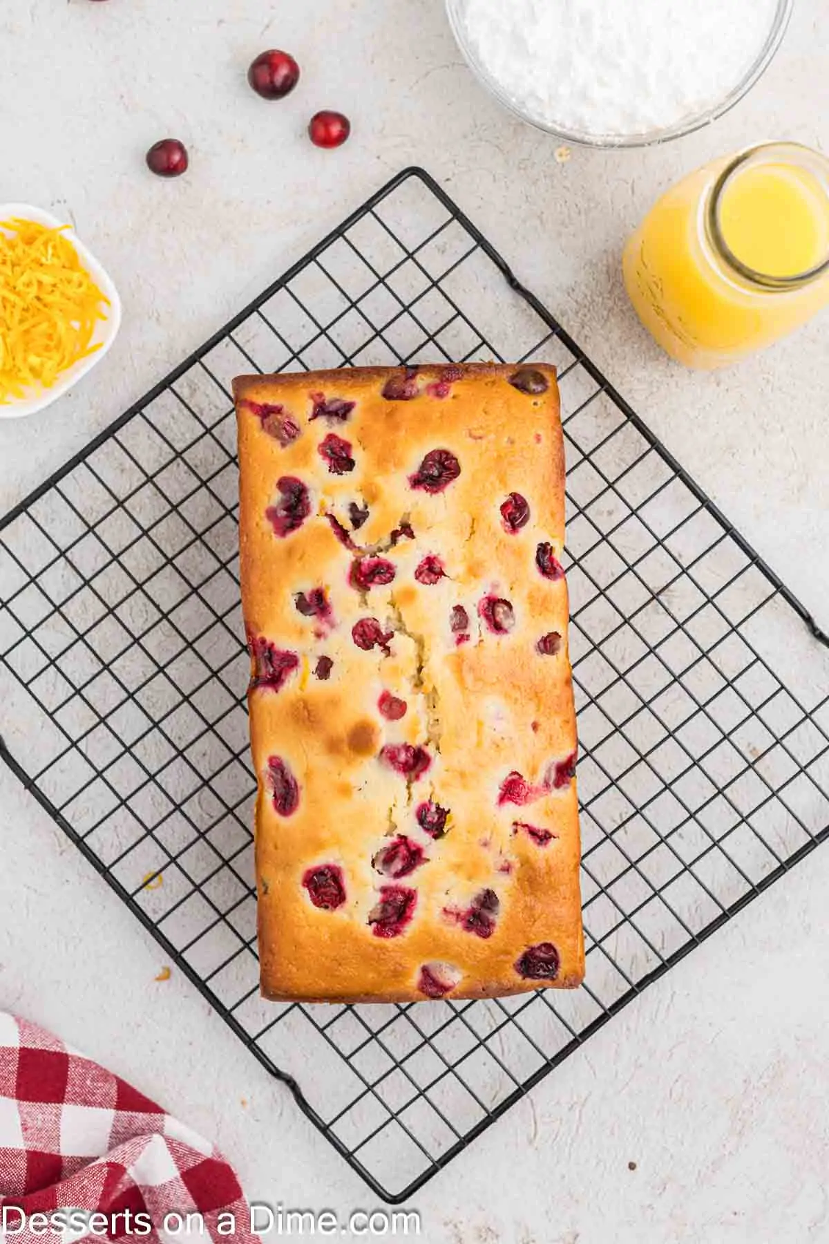 Cranberry bread on wire rack.