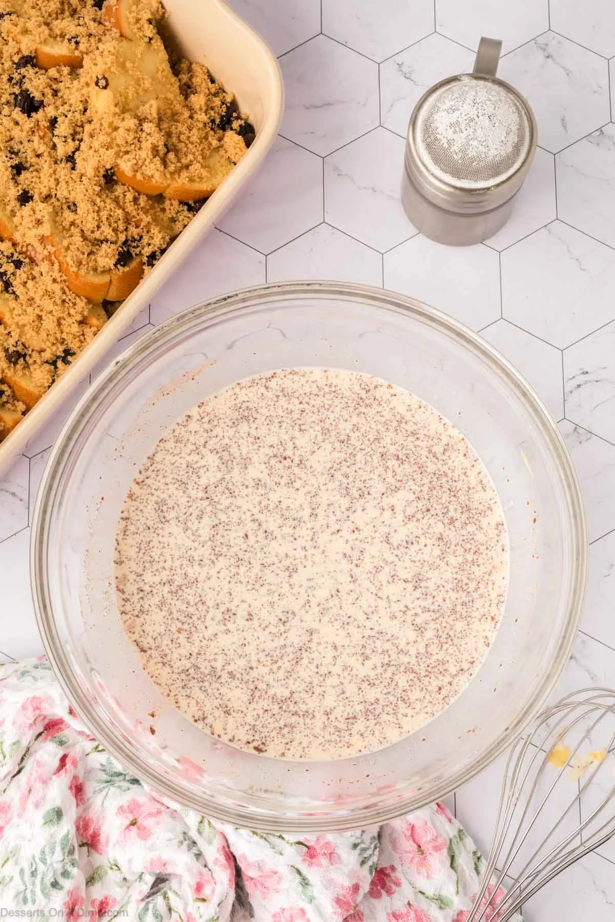 Mixing bowl with milk mixture combined together.