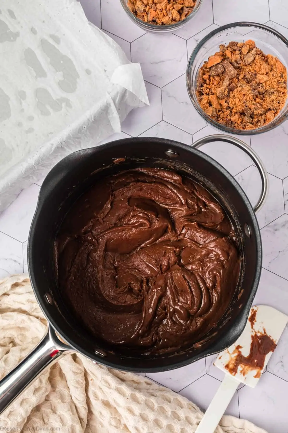 Chocolate mixture combined in pan.