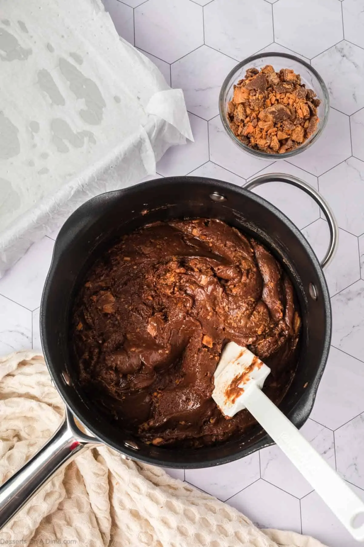 Butterfingers folded into mixture.