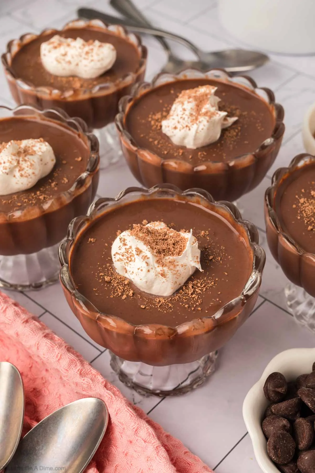 Dark Chocolate Pudding in cups with whipped cream.