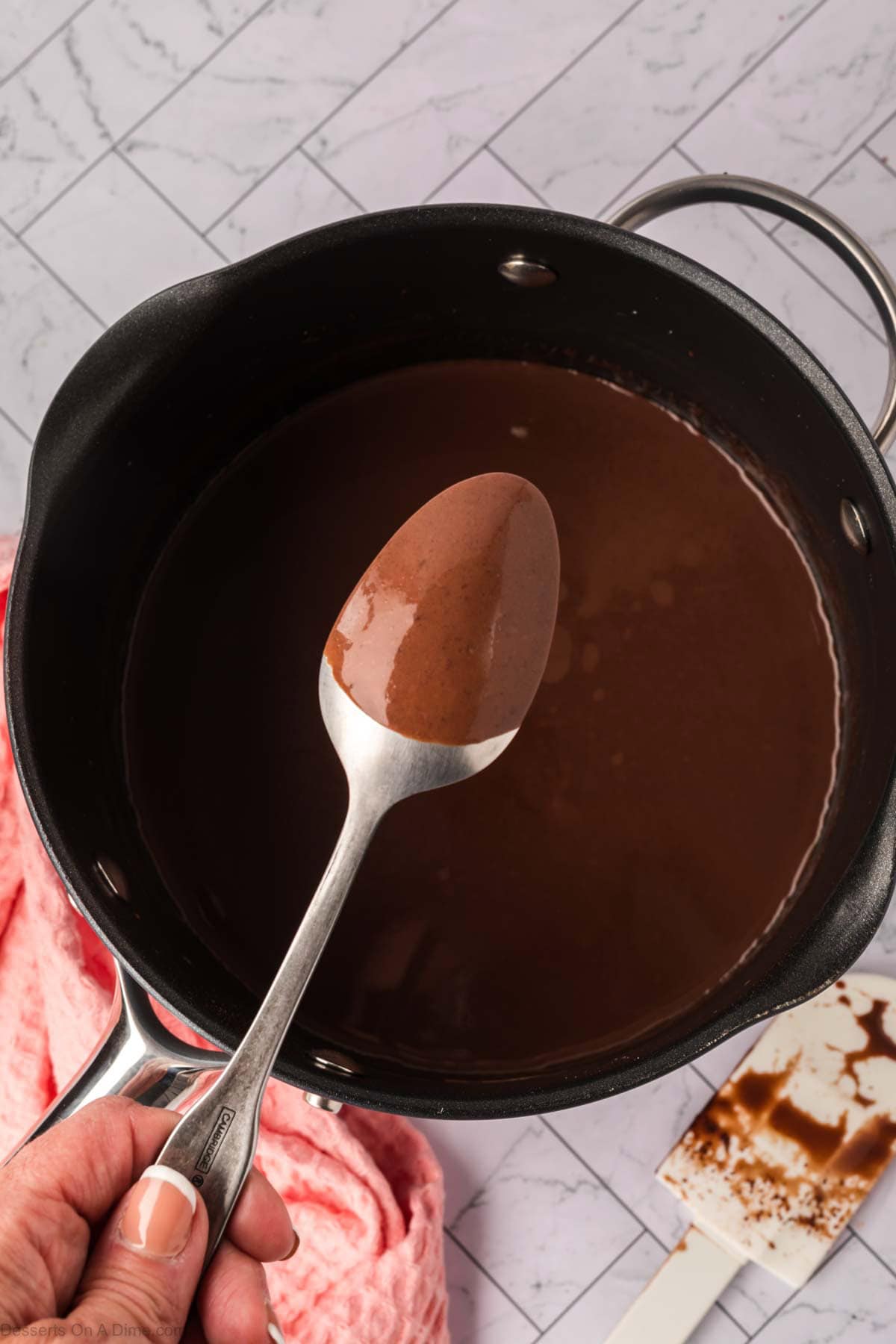 Mixture thickening and coated spoon.