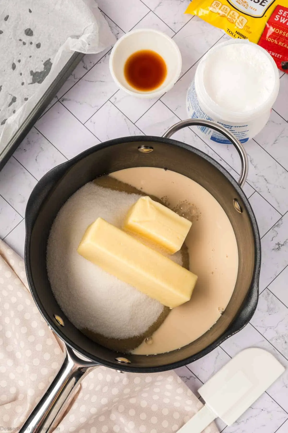 Butter, sugar and sweetened condensed milk in a pan. 