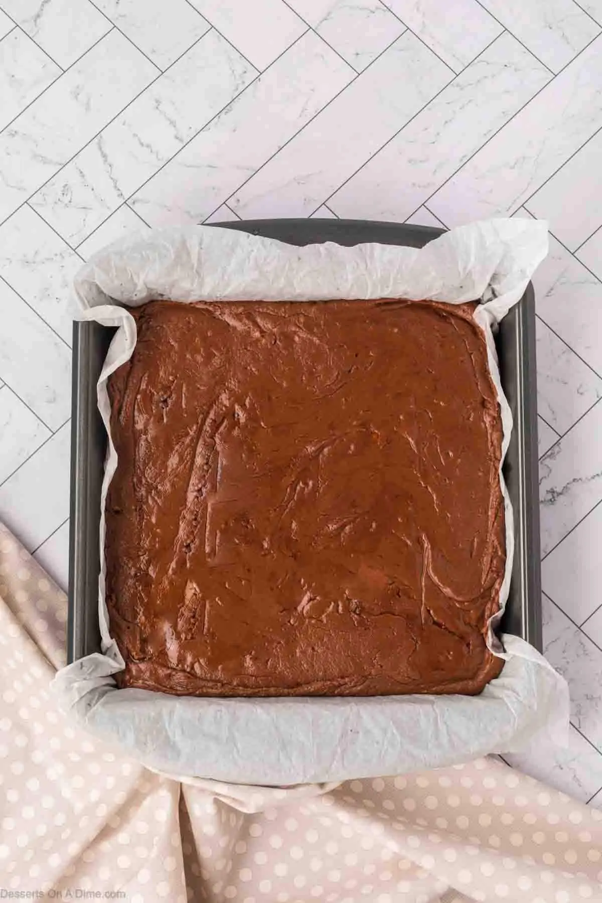 Fudge mixture spread into pan. 